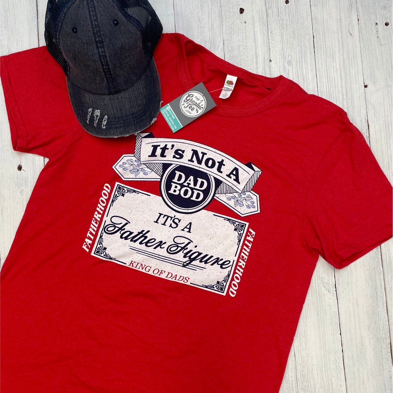 It's Not A Dad Bod It's A Father Figure SS Graphic Tee by The Graphic Tee, featuring humorous text on a comfortable cotton shirt.