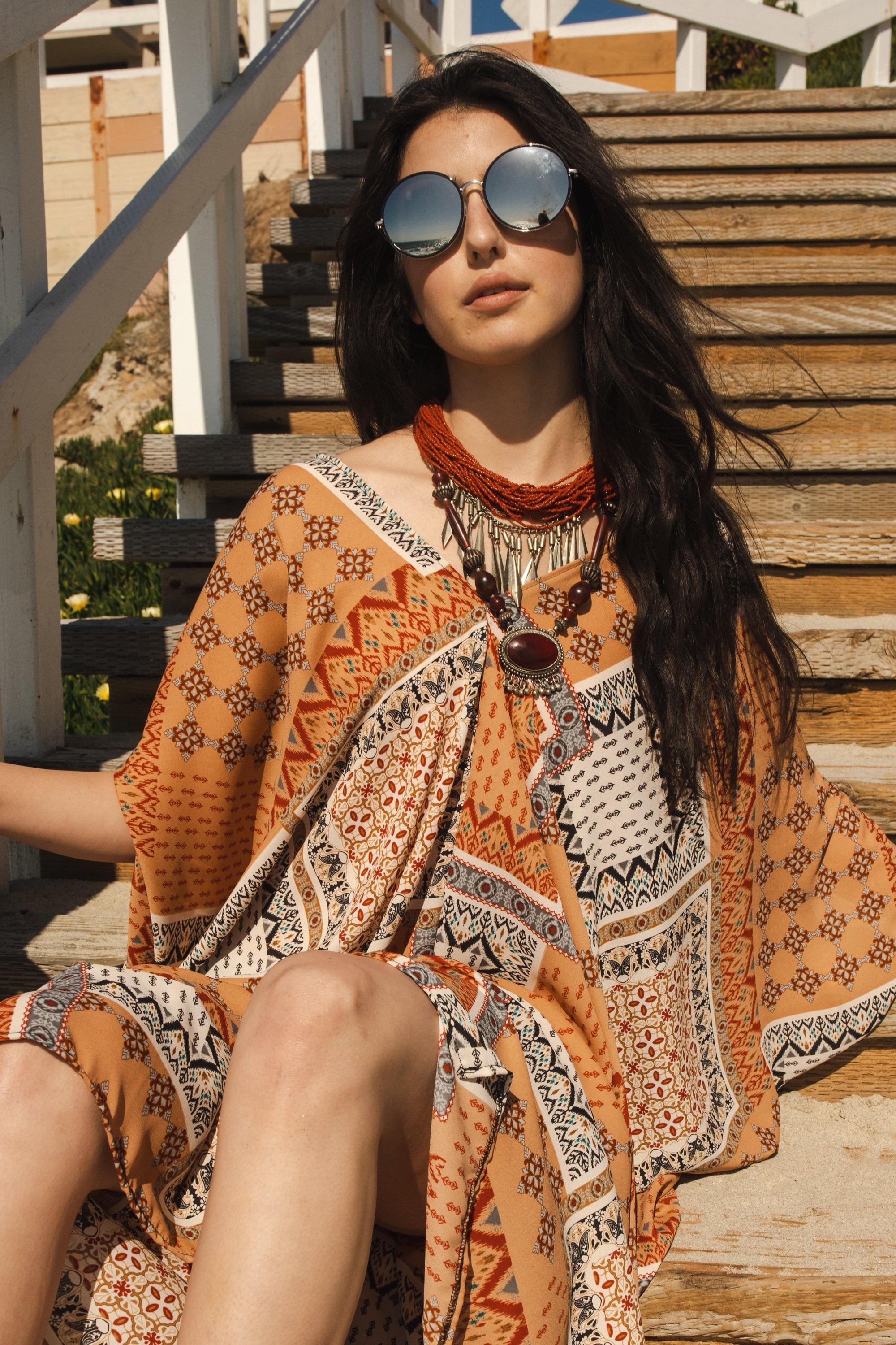 Handmade Hera Caftan by Jennafer Grace featuring flowing fabric and intricate details in a vibrant, elegant design.