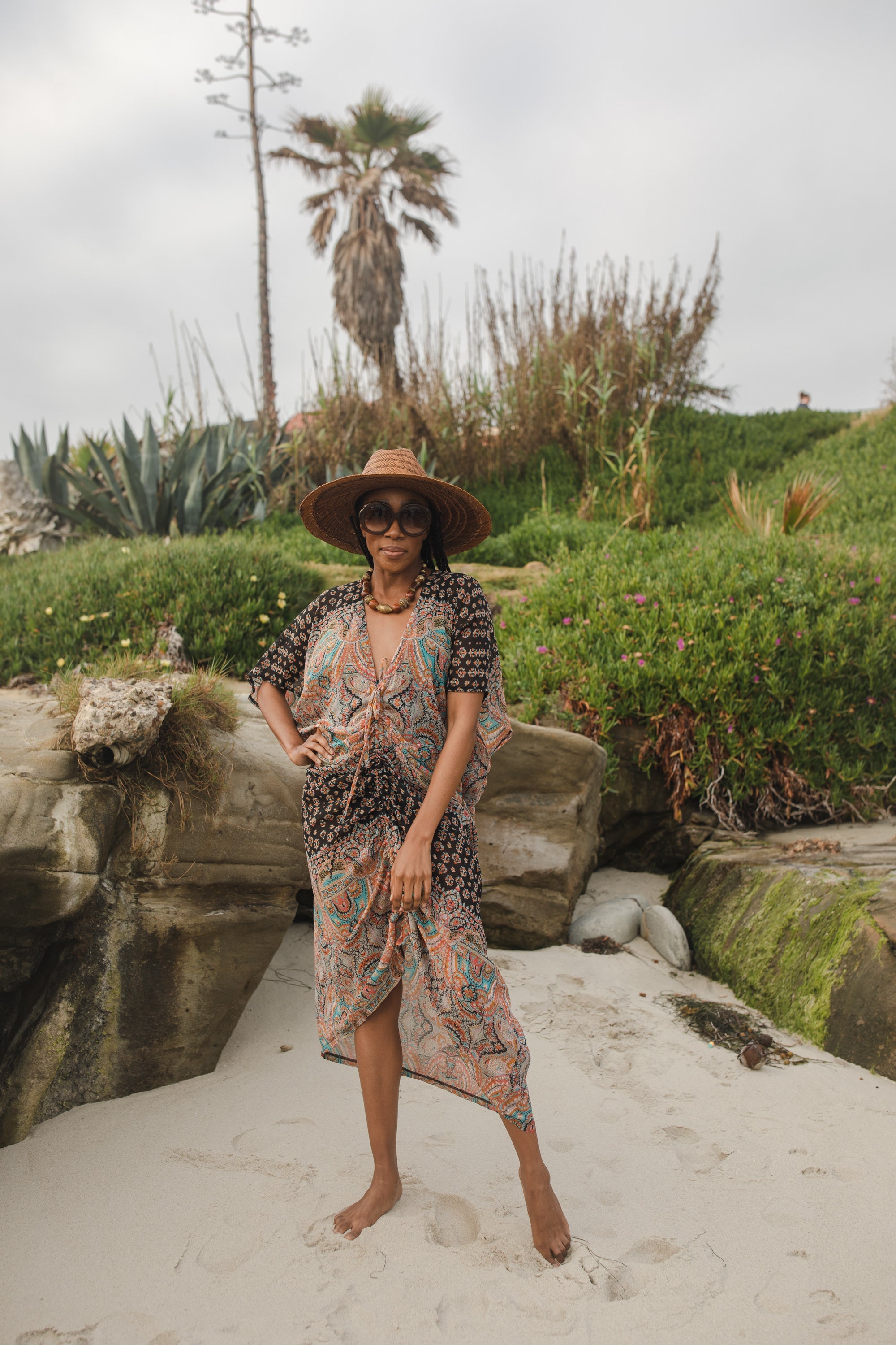 Jennafer Grace Actius Caftan in Taj, elegant long kaftan dress with intricate patterns and flowing fabric.