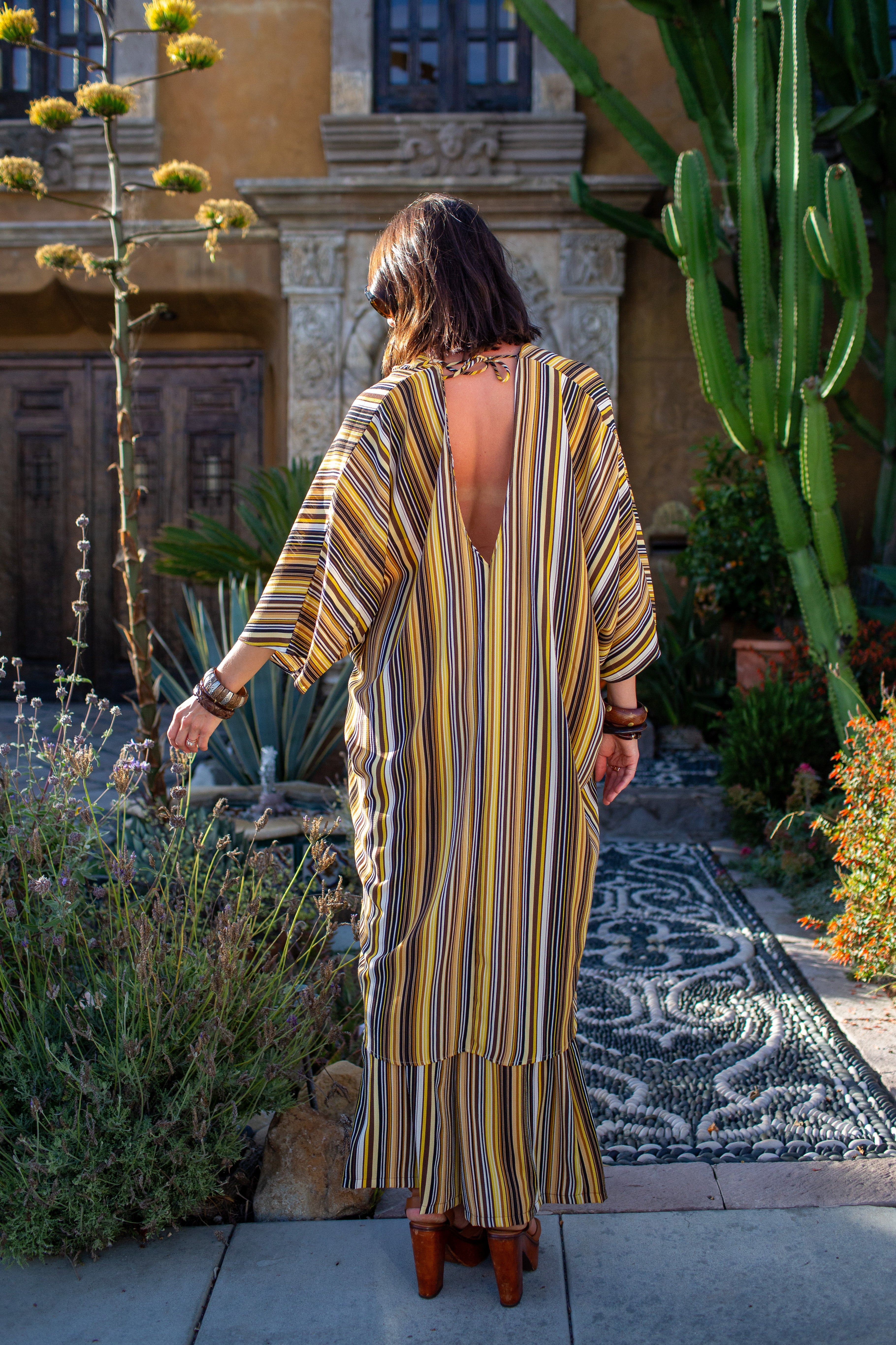 Bank striped tunic caftan set with matching palazzo pants by Jennafer Grace, featuring a relaxed fit and bold stripe pattern.