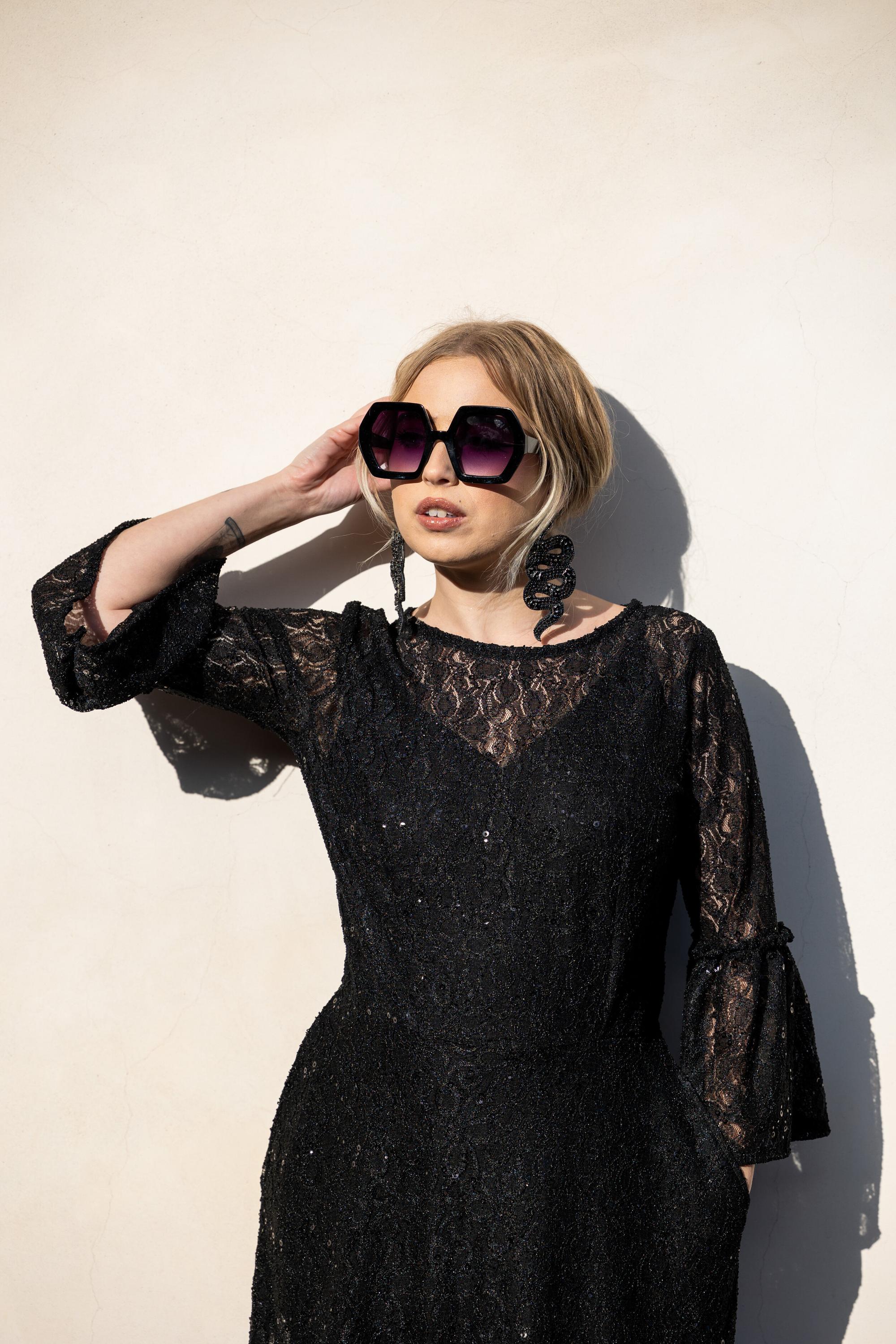 Black sequin lace ruffle dress by Jennafer Grace featuring intricate lace details and elegant ruffles, handmade evening style.