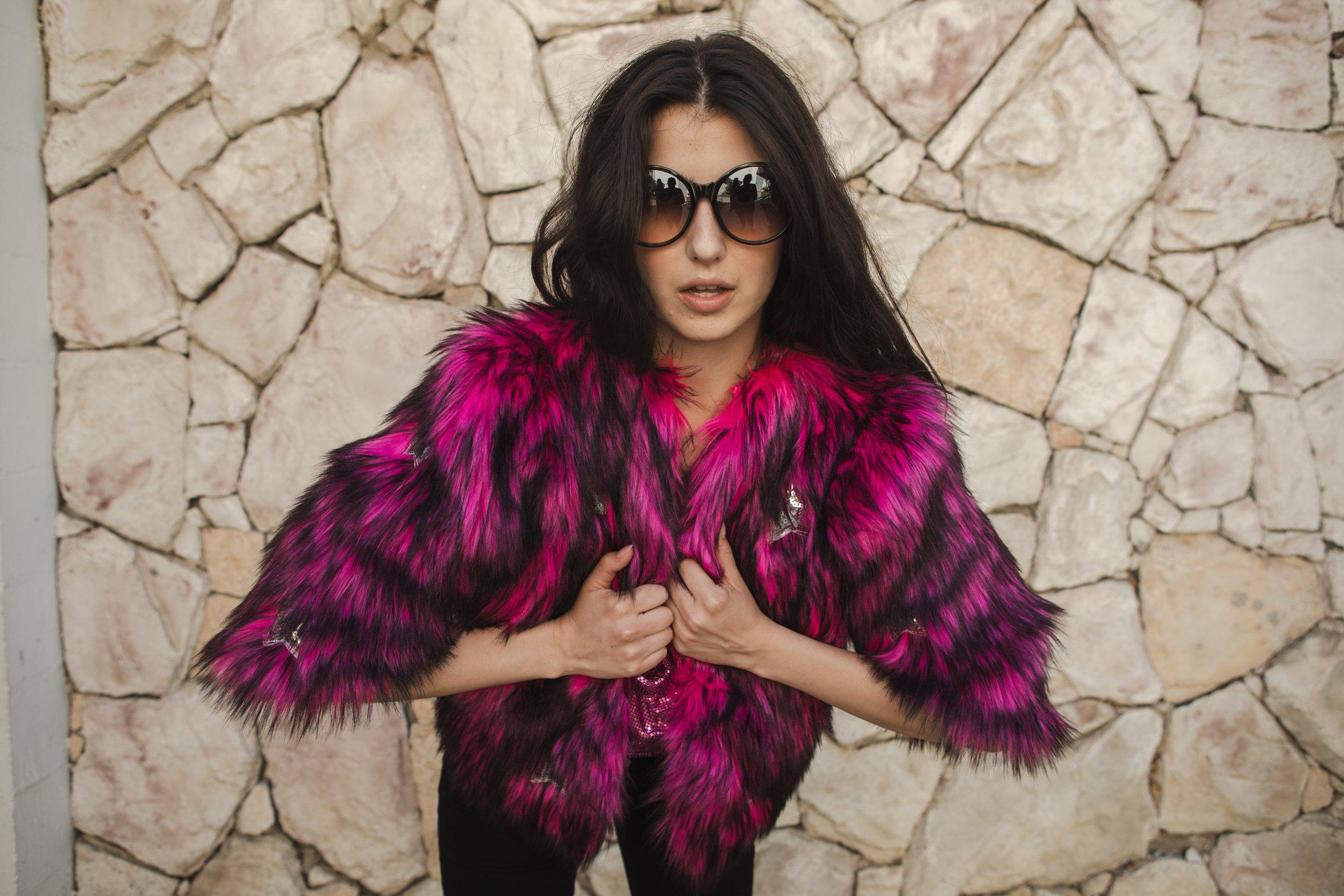 Jennafer Grace Planet Queen faux fur jacket in vibrant monster pink with a plush, textured appearance and handmade details.