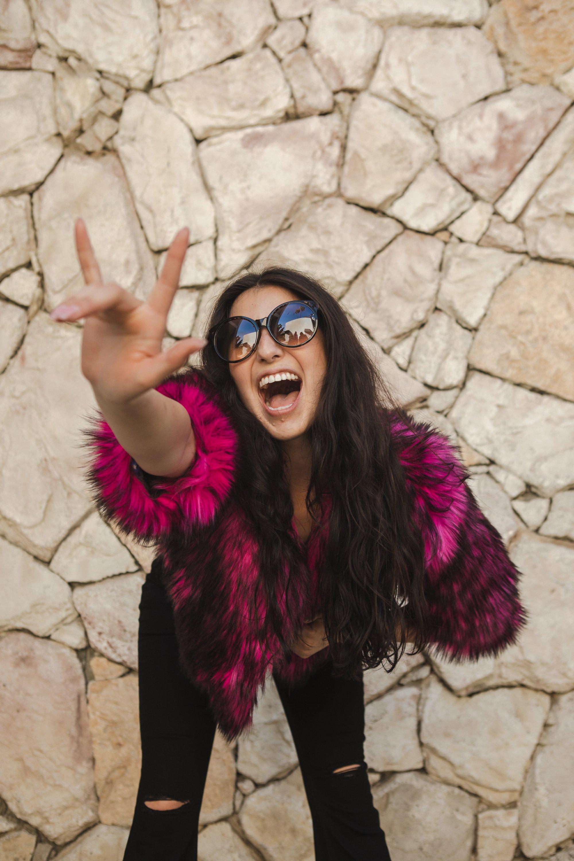 Jennafer Grace Planet Queen faux fur jacket in vibrant monster pink, showcasing the plush, handmade design and bright color.