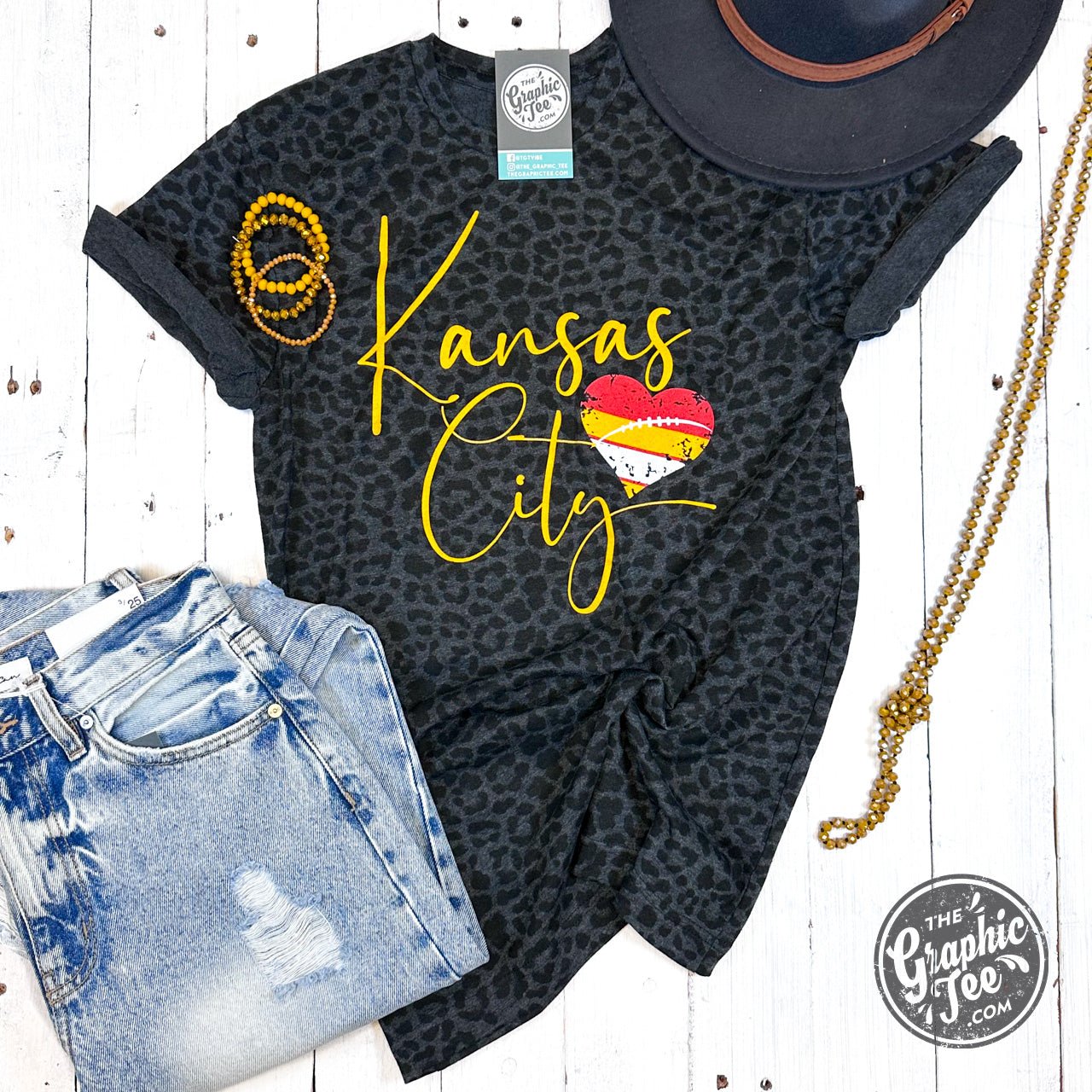 Black leopard Kansas City graphic unisex short sleeve tee by The Graphic Tee, showcasing a bold animal print design.