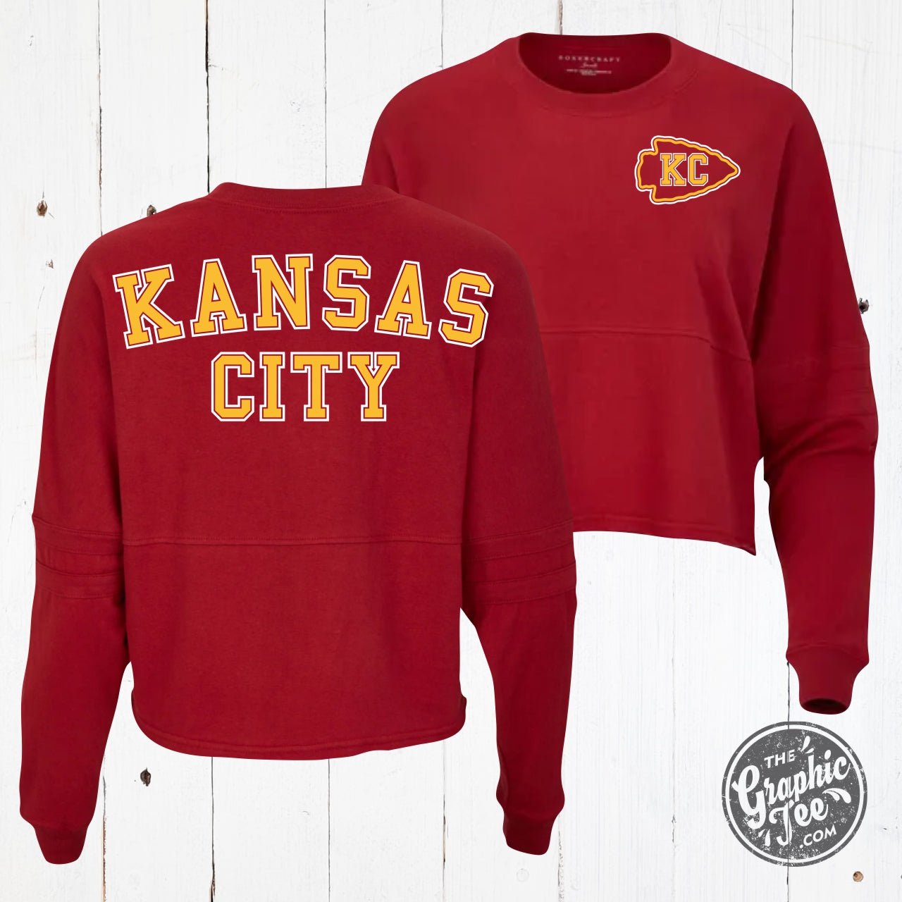 Kansas City Brick Red Ladies Cropped Jersey LS Graphic Tee by The Graphic Tee, featuring a stylish cropped fit and Kansas City graphic design.