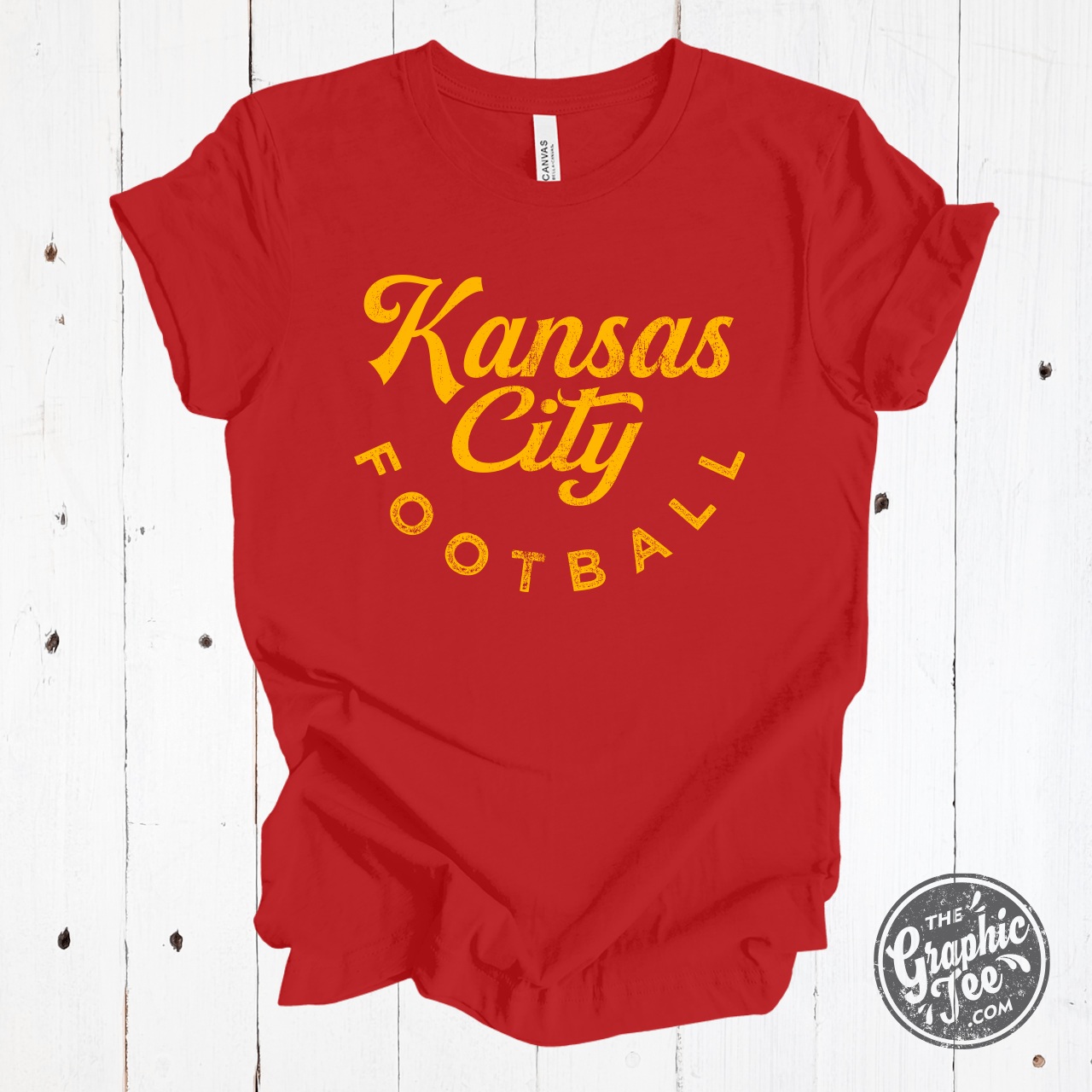 Kansas City Football red and gold short sleeve graphic tee by The Graphic Tee, featuring team colors and logo design.