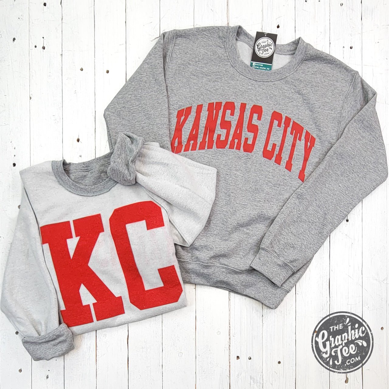 Kansas City reversible sport grey crewneck sweatshirt with graphic design, from The Graphic Tee, shown flat on a white background.