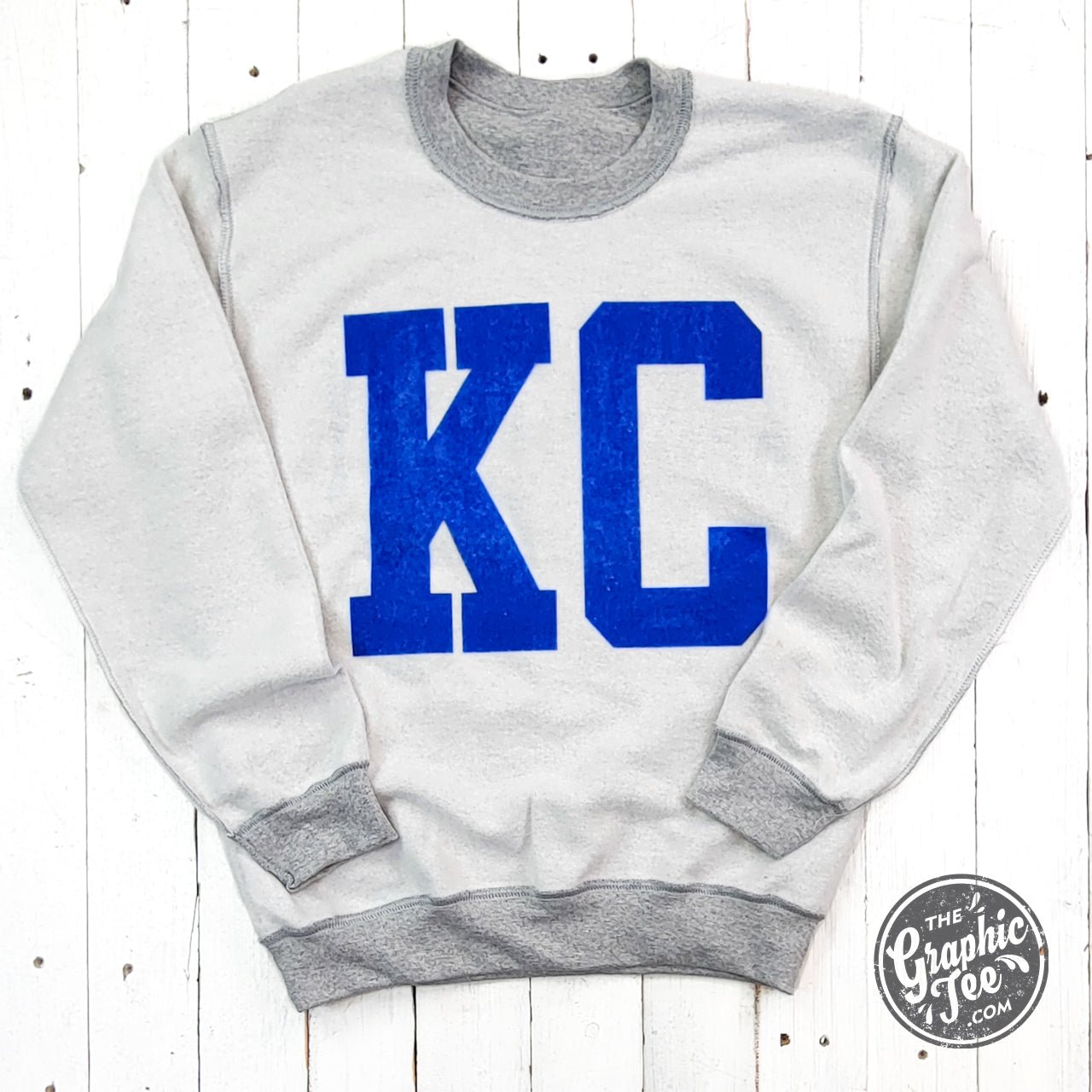Kansas City Royal Blue Ink reversible crewneck sweatshirt from The Graphic Tee, with sport grey color and graphic design.