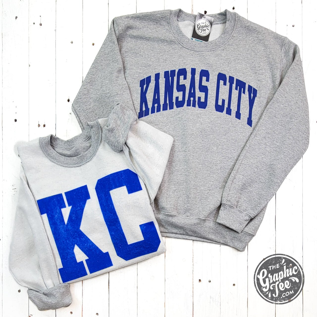 Kansas City Royal Blue Ink reversible sport grey crewneck sweatshirt by The Graphic Tee, showing front and back views.