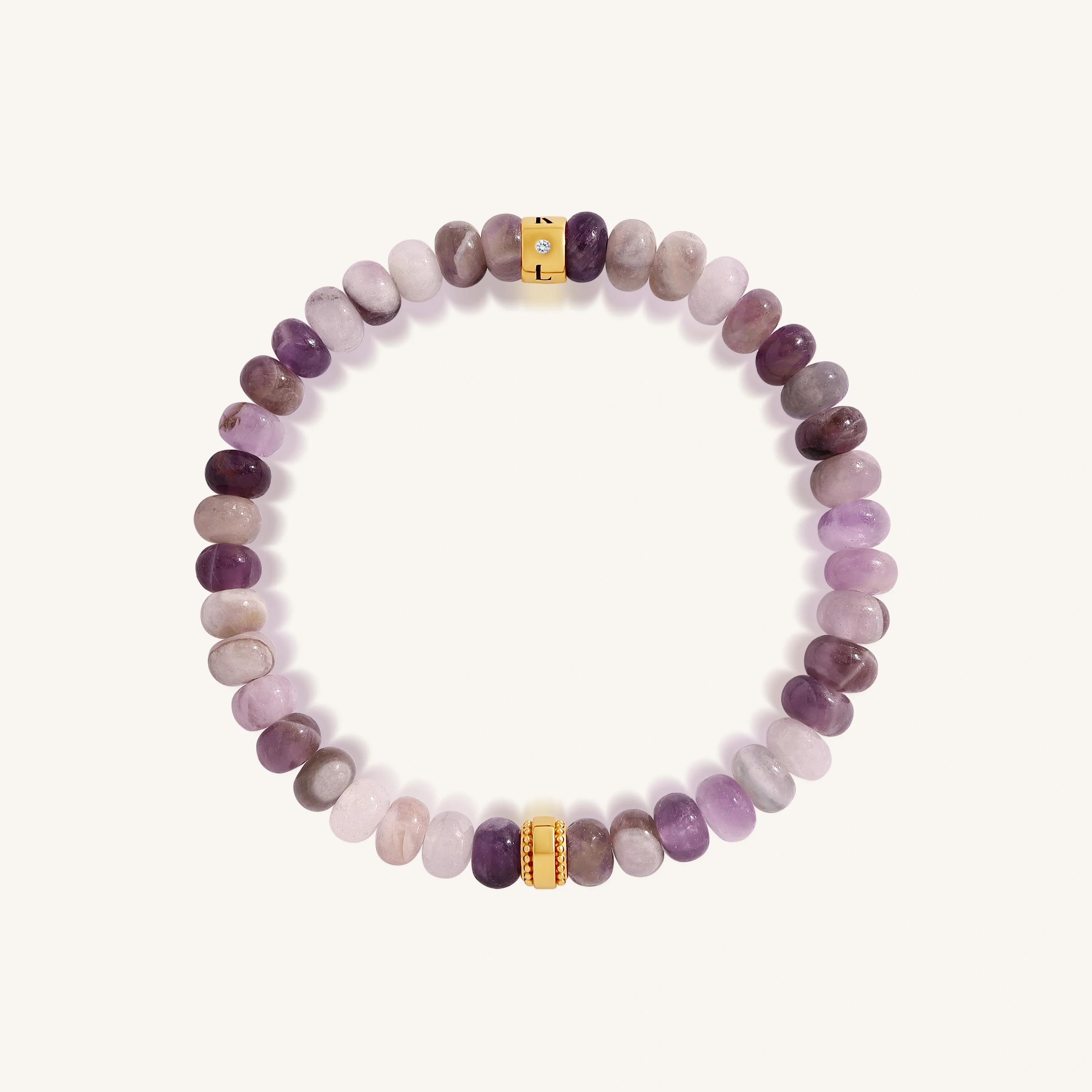 Women’s gold bracelet featuring amethyst and cubic zirconia stones from Karma and Luck's Calm Spirit collection.