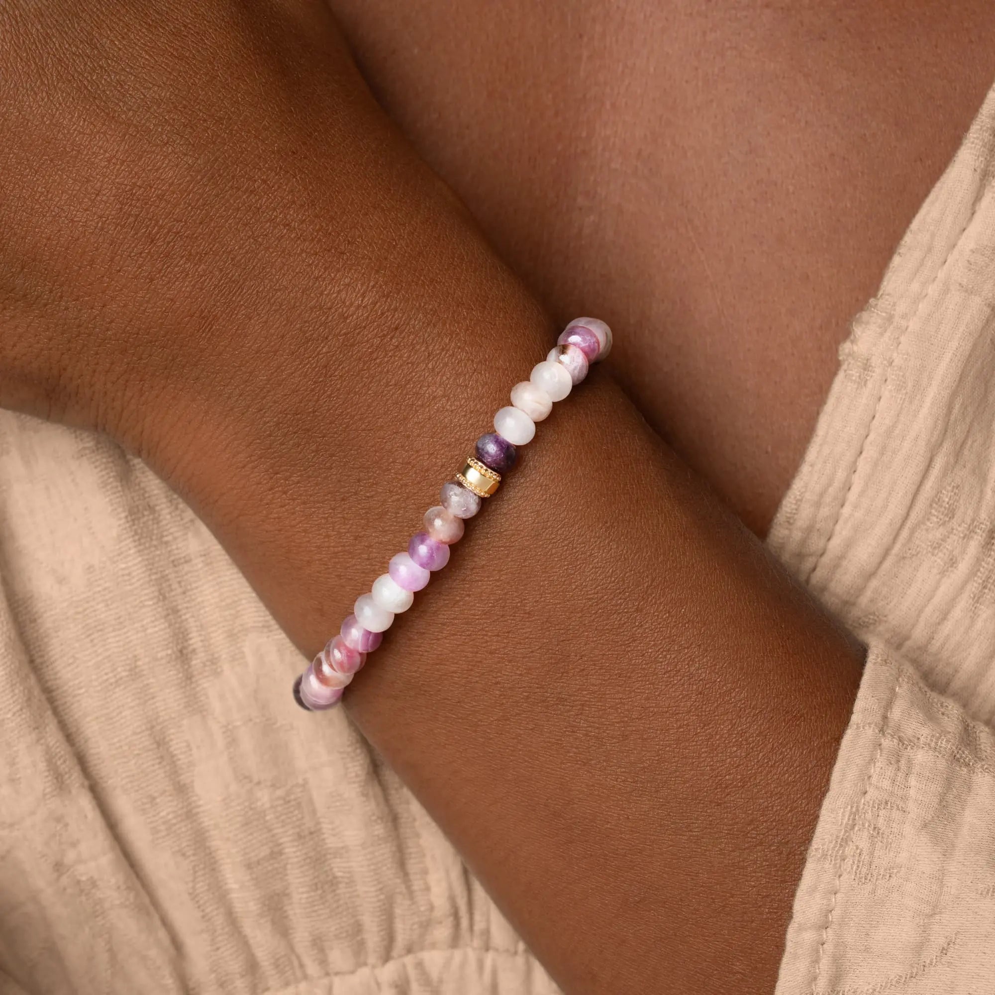 Women's gold bracelet featuring amethyst and cubic zirconia stones from Karma and Luck's Calm Spirit collection.