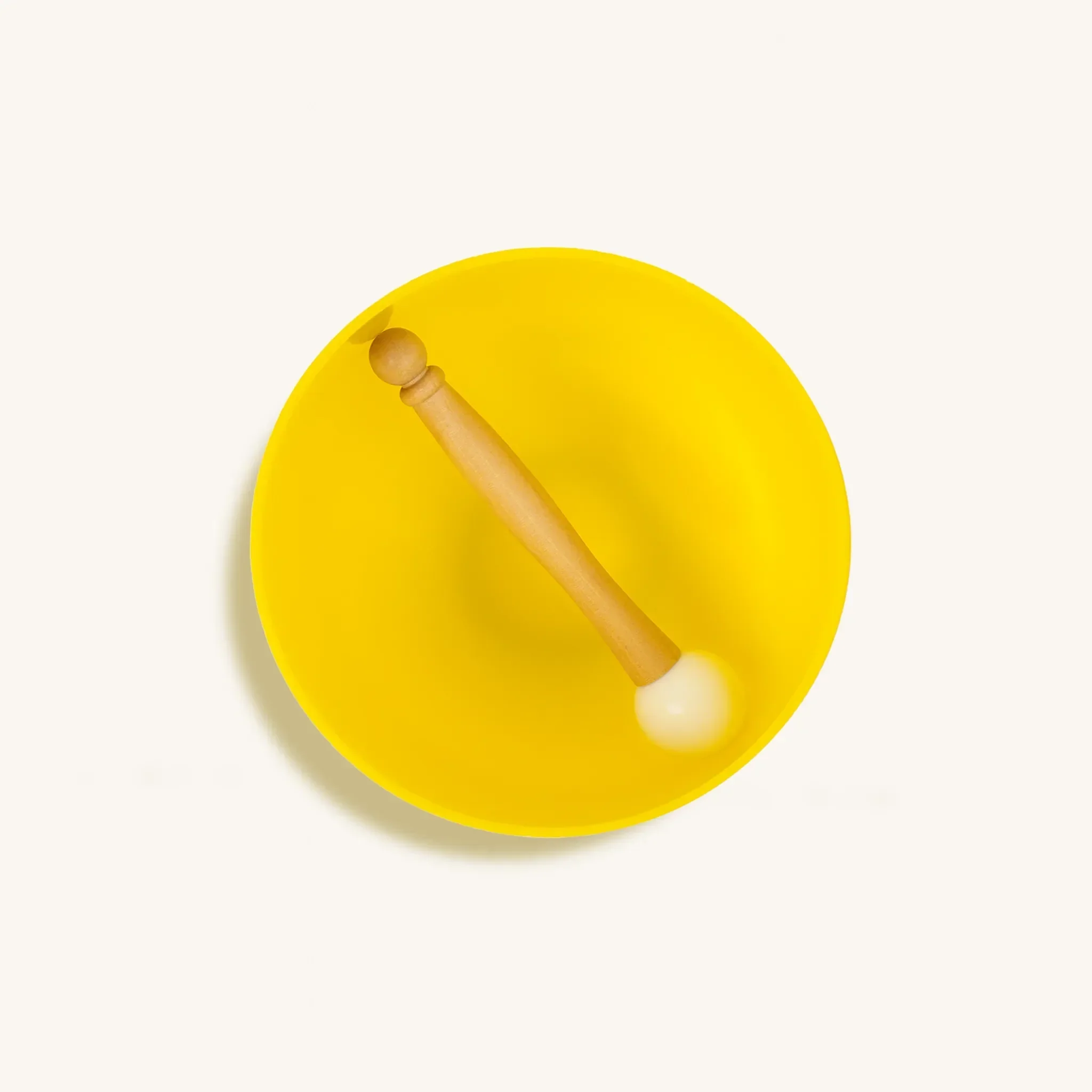 Yellow Solar Plexus Chakra singing bowl from Karma and Luck, used as home decor with intricate designs and a polished finish.