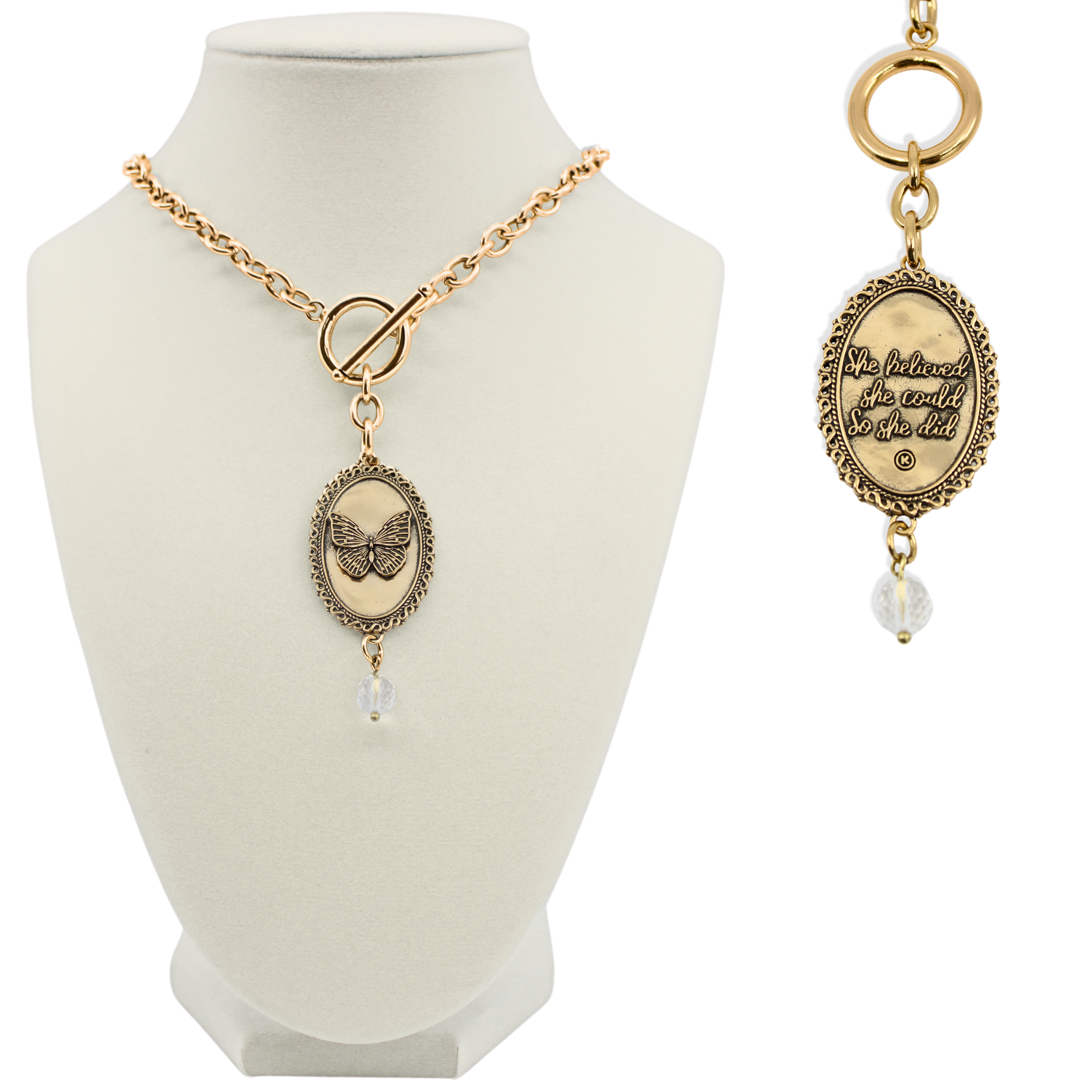 Katia Designs butterfly choker necklace in antique gold with "She Believed She Could" engraved, stylish jewelry accessory on a model.