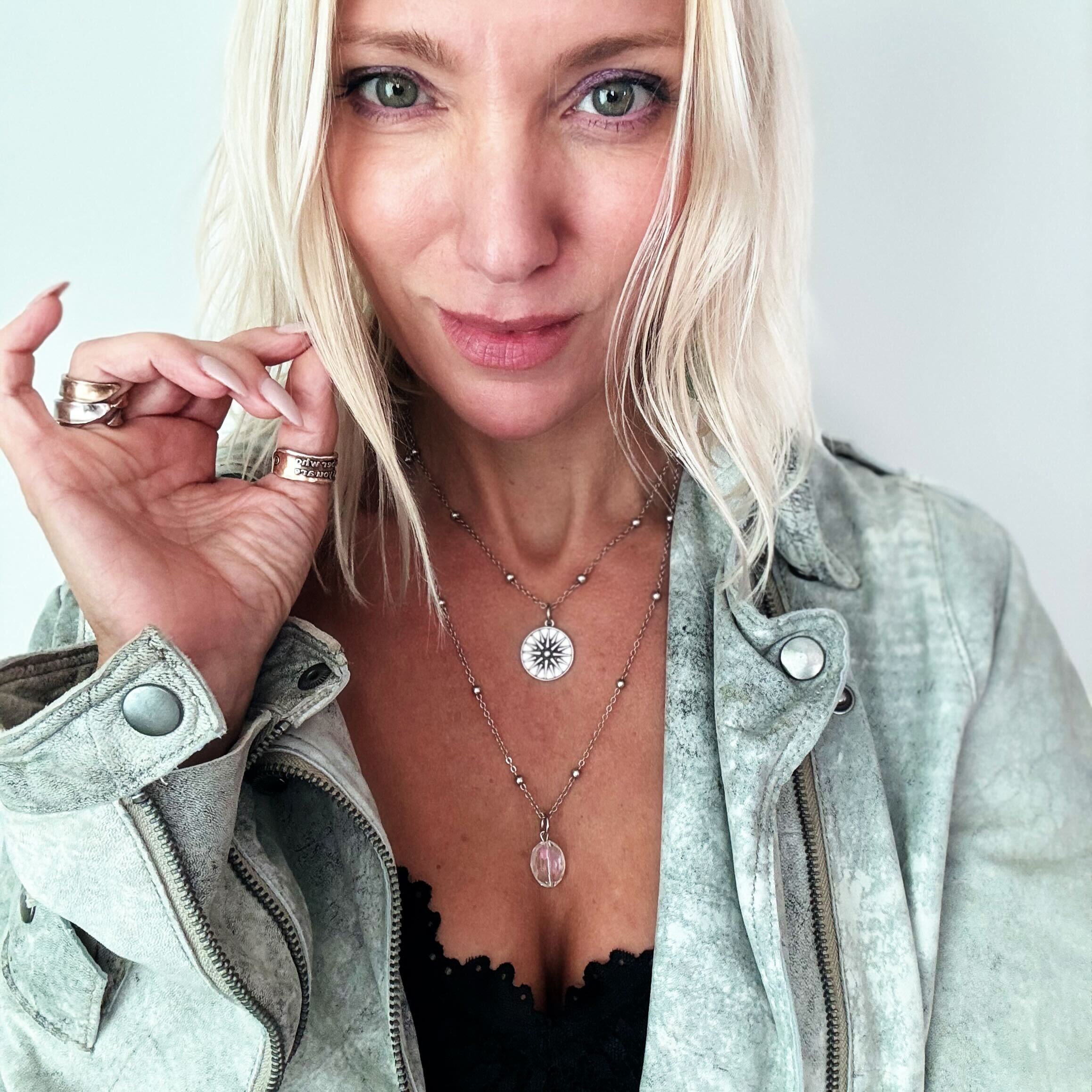 Silver dainty star necklace by Katia Designs featuring the inspiring "This Too Shall Pass" message.