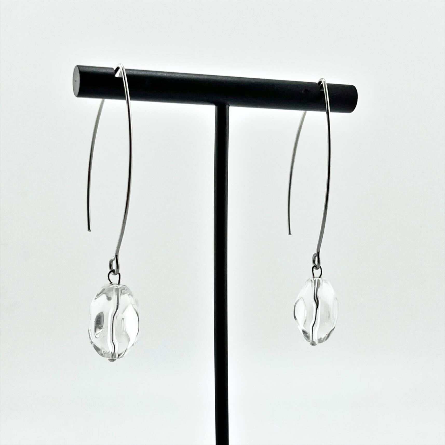 Small stone drop earrings by Katia Designs featuring antique gold finish and crystal quartz stones.