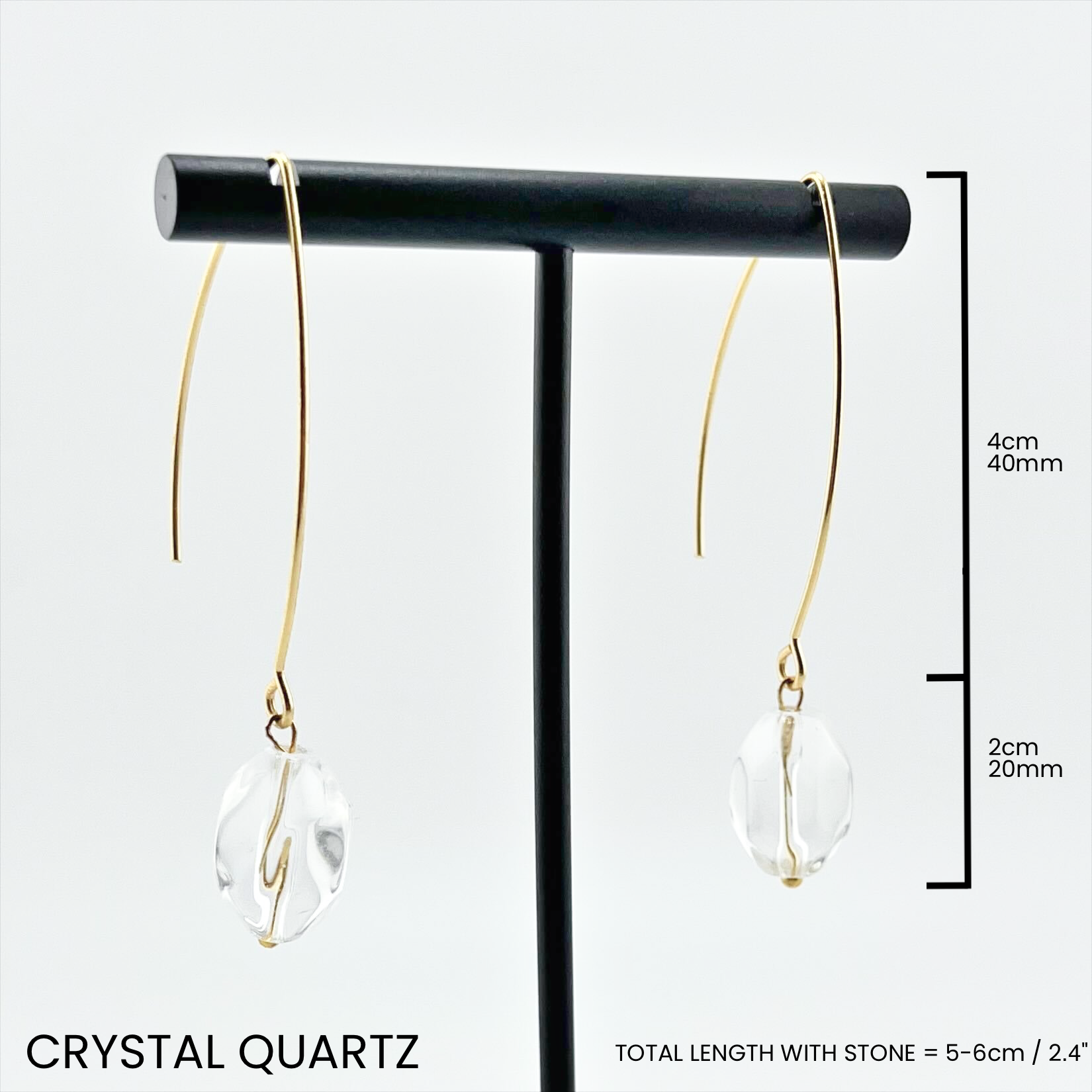 Katia Designs small stone drop earrings with antique gold finish and crystal quartz accents, elegant and delicate jewelry accessory.