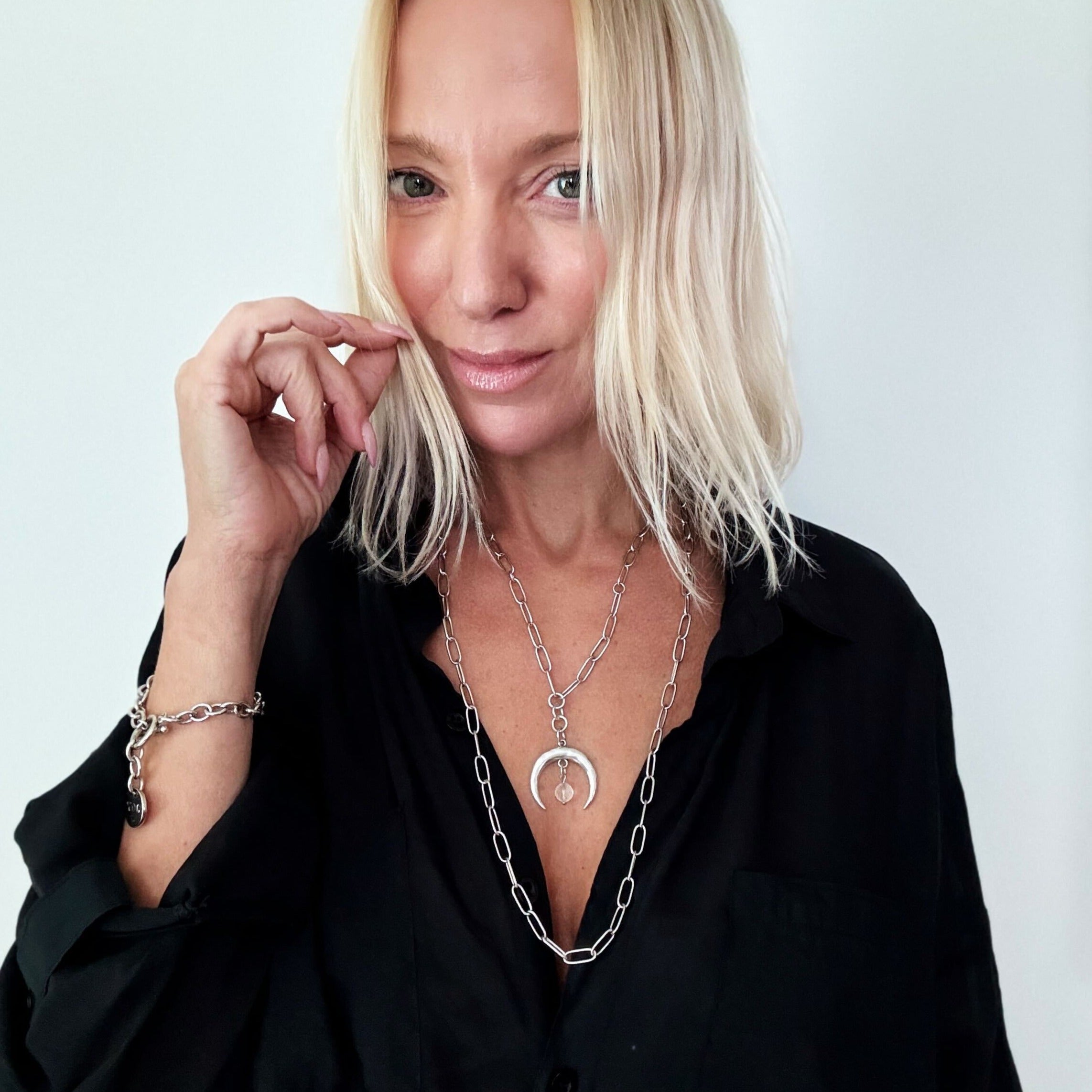 Katia Designs antique gold crescent moon klink necklace with grateful message, featuring intricate moon charm and elegant chain.