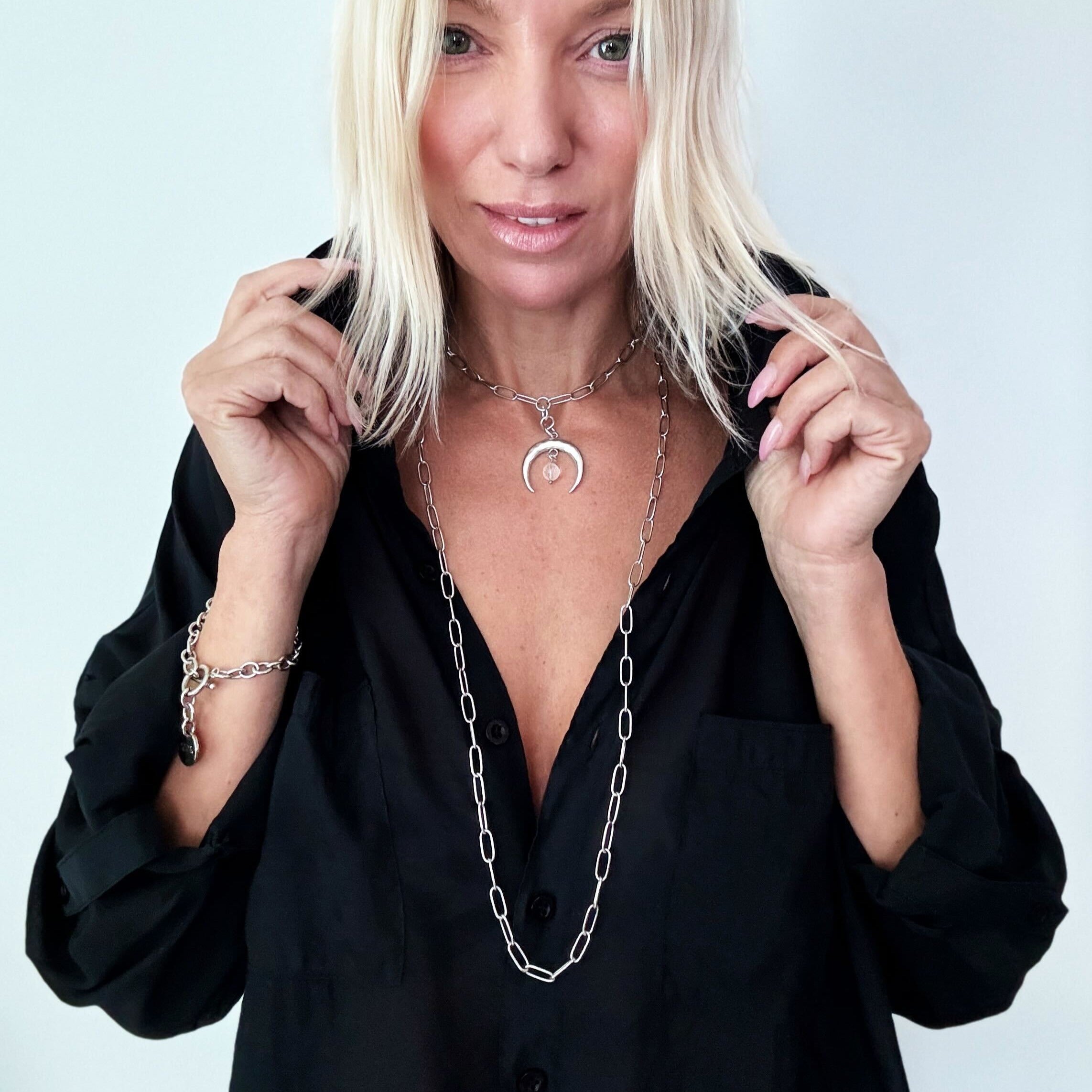 Katia Designs antique gold crescent moon klink necklace featuring a delicate, textured moon pendant on a fine chain.