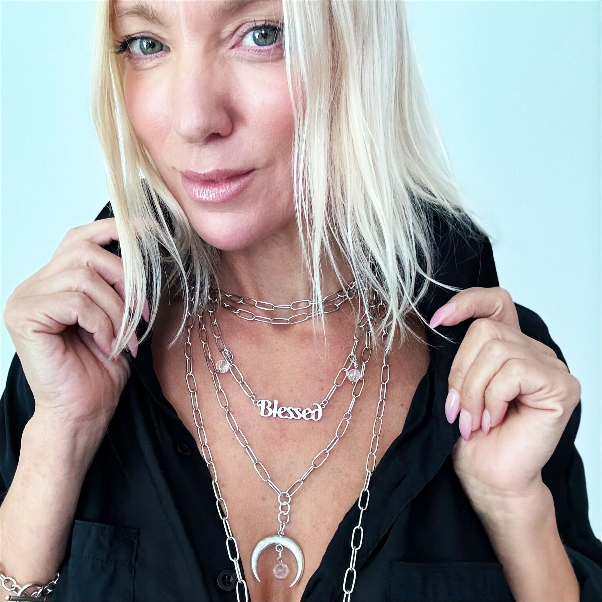 Katia Designs antique gold crescent moon klink necklace featuring a delicate, artistic moon pendant on a chain.