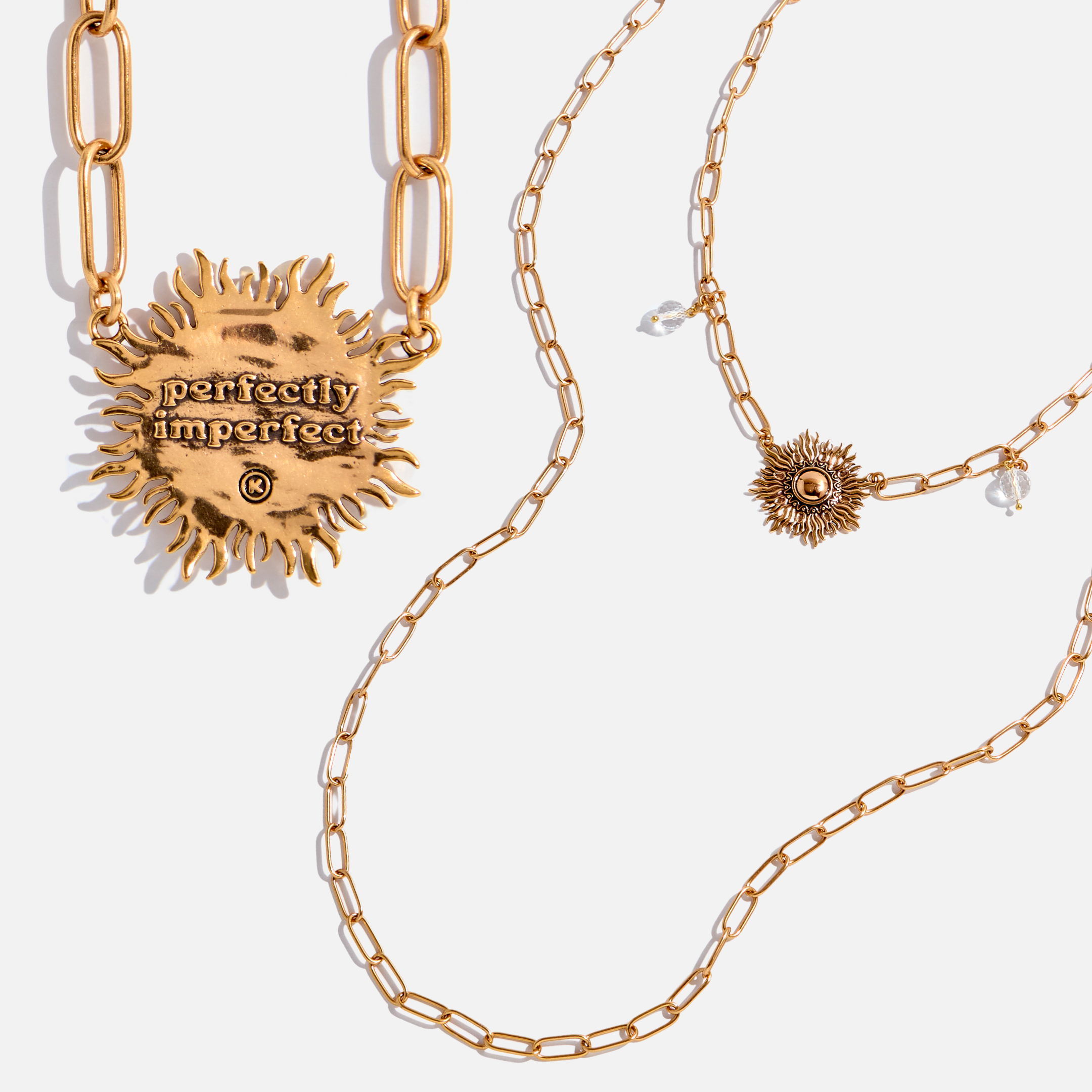 Katia Designs antique gold starburst long chain necklace with imperfect, handcrafted design, featuring a delicate, elongated chain.