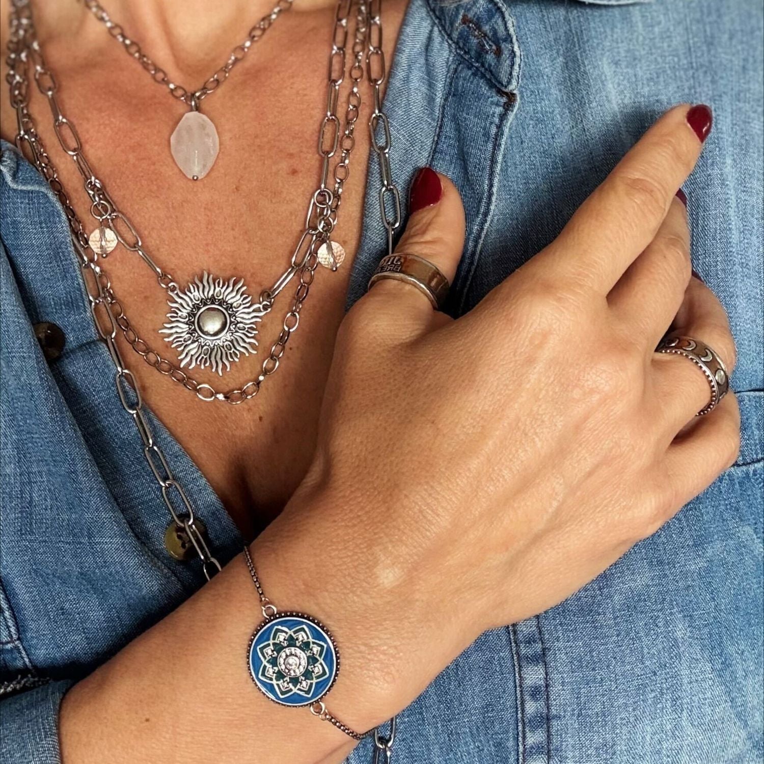 Katia Designs antique gold starburst long chain necklace with imperfect, handcrafted design, featuring a detailed starburst pendant.