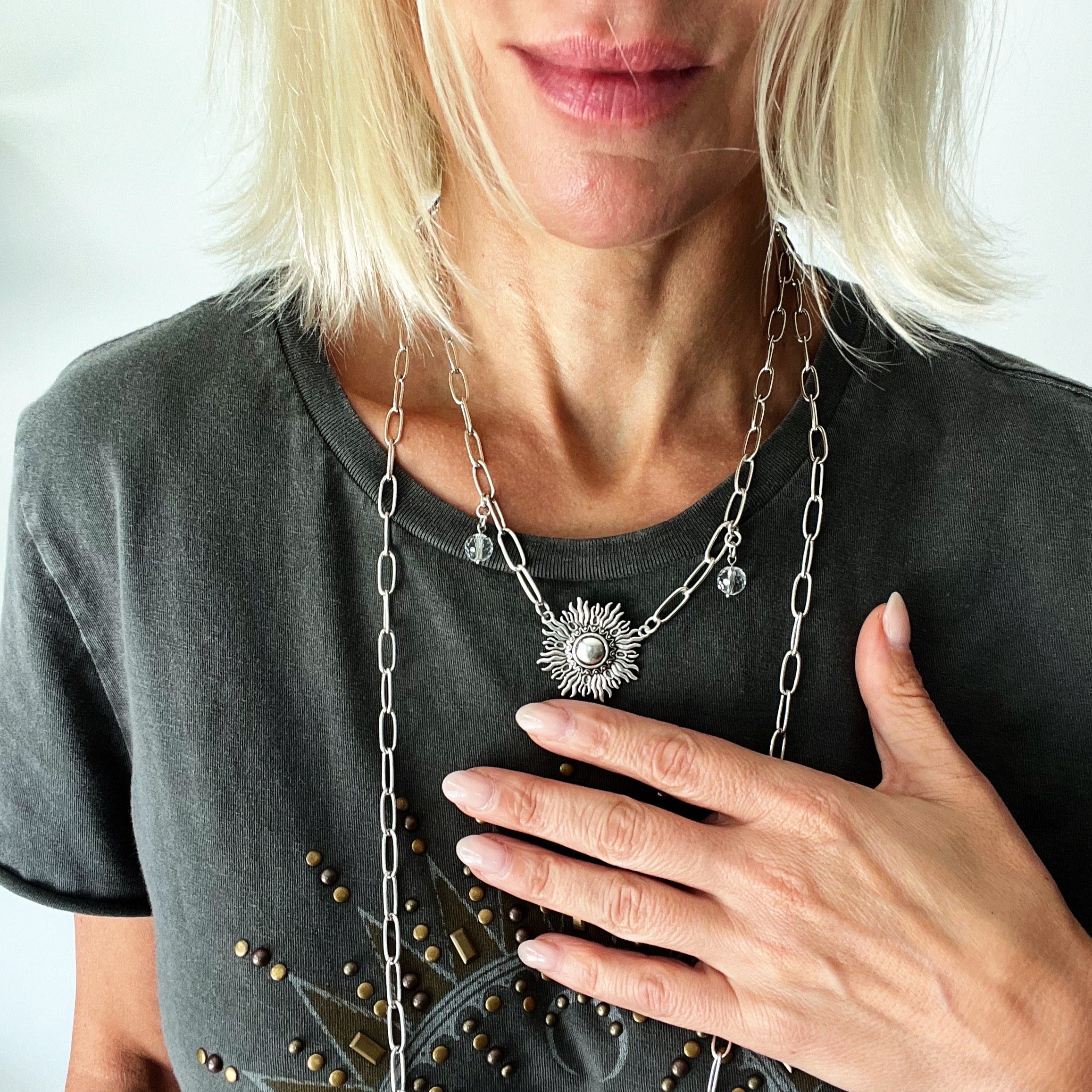 Katia Designs antique gold starburst long chain necklace with a handcrafted, imperfect design featuring a delicate pendant.