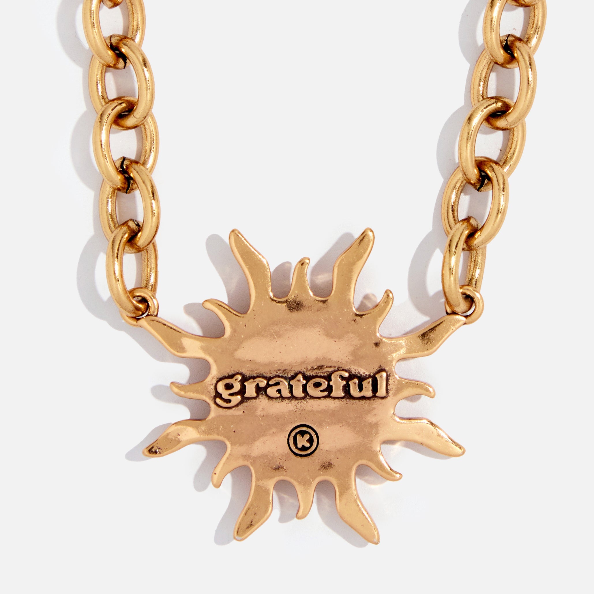 Katia Designs antique gold Grateful Sun midi choker necklace featuring a detailed sun pendant on a delicate chain.