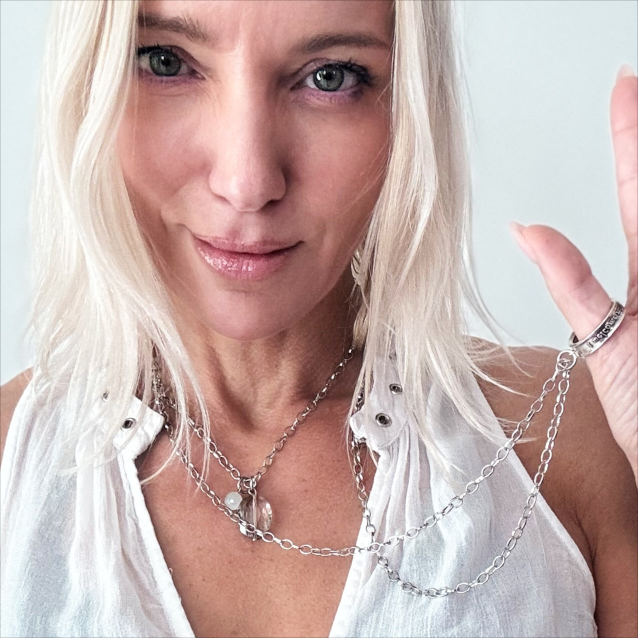 Katia Designs gold original necklace with clear AB crystal accents featuring the engraved message "Remember Who the F*ck You Are" ring.
