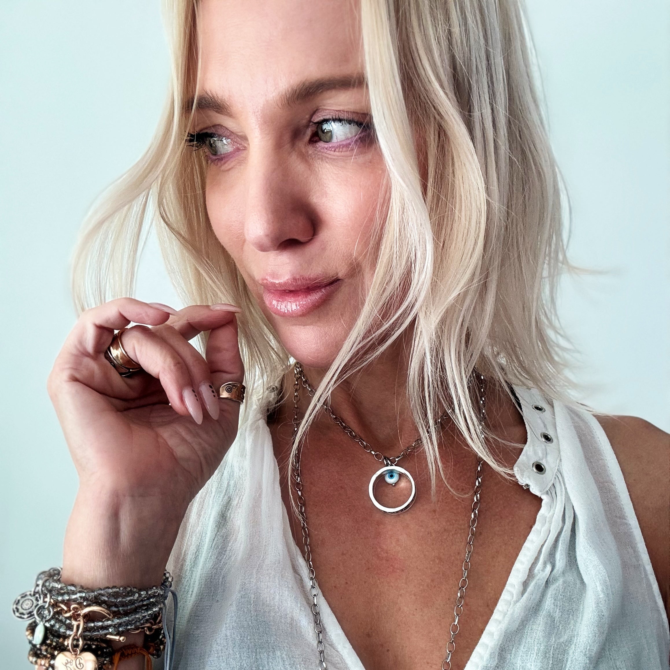 Katia Designs gold original necklace with clear AB crystal charm featuring "Remember Who the F*ck You Are" message and powerful design
