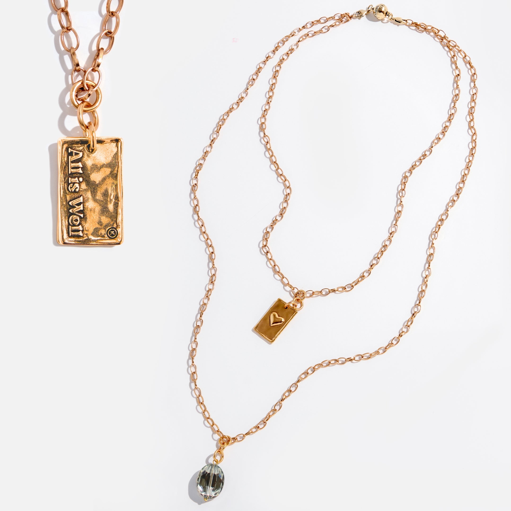 Katia Designs All Is Well Original Lite Necklace with antique gold chain and smoky crystal pendant.