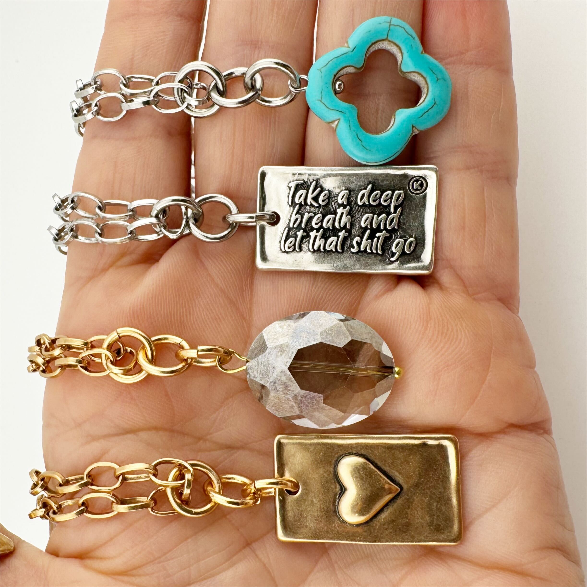 Katia Designs original lite necklace with antique gold finish and smoky crystal, featuring the "Take a Deep Breath and Let That Shit Go" pendant.