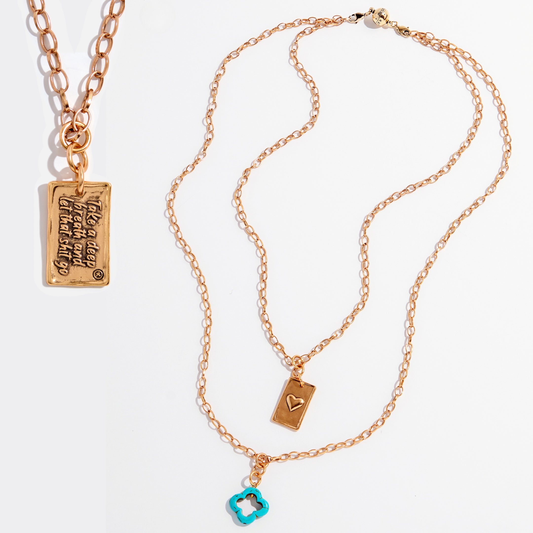 Katia Designs original Lite necklace with antique gold finish and smoky crystal, featuring engraved "Take a Deep Breath and Let That Shit Go" pendant.