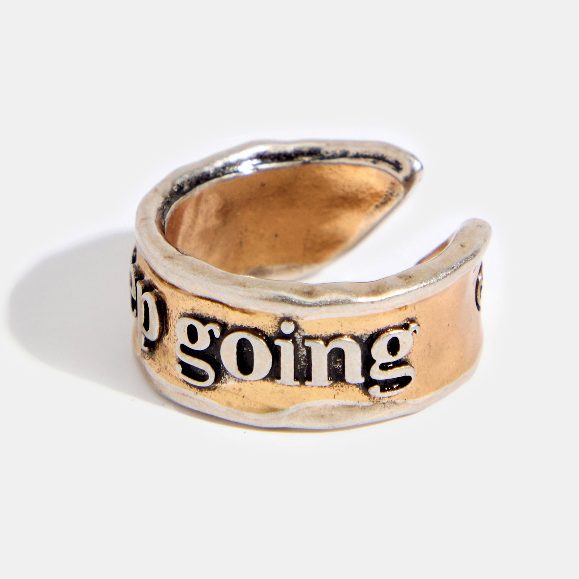 Adjustable ring by Katia Designs with engraved "Keep Going Remember" message, featuring a sleek silver finish.