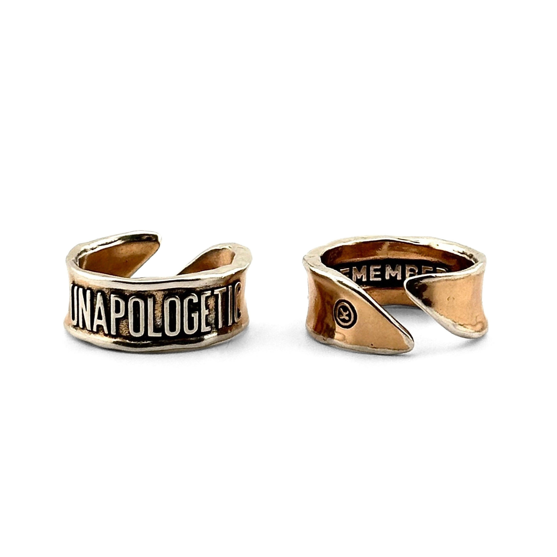 Adjustable Katia Designs Unapologetic Remember ring with bold design and silver finish, shown on a user's finger.