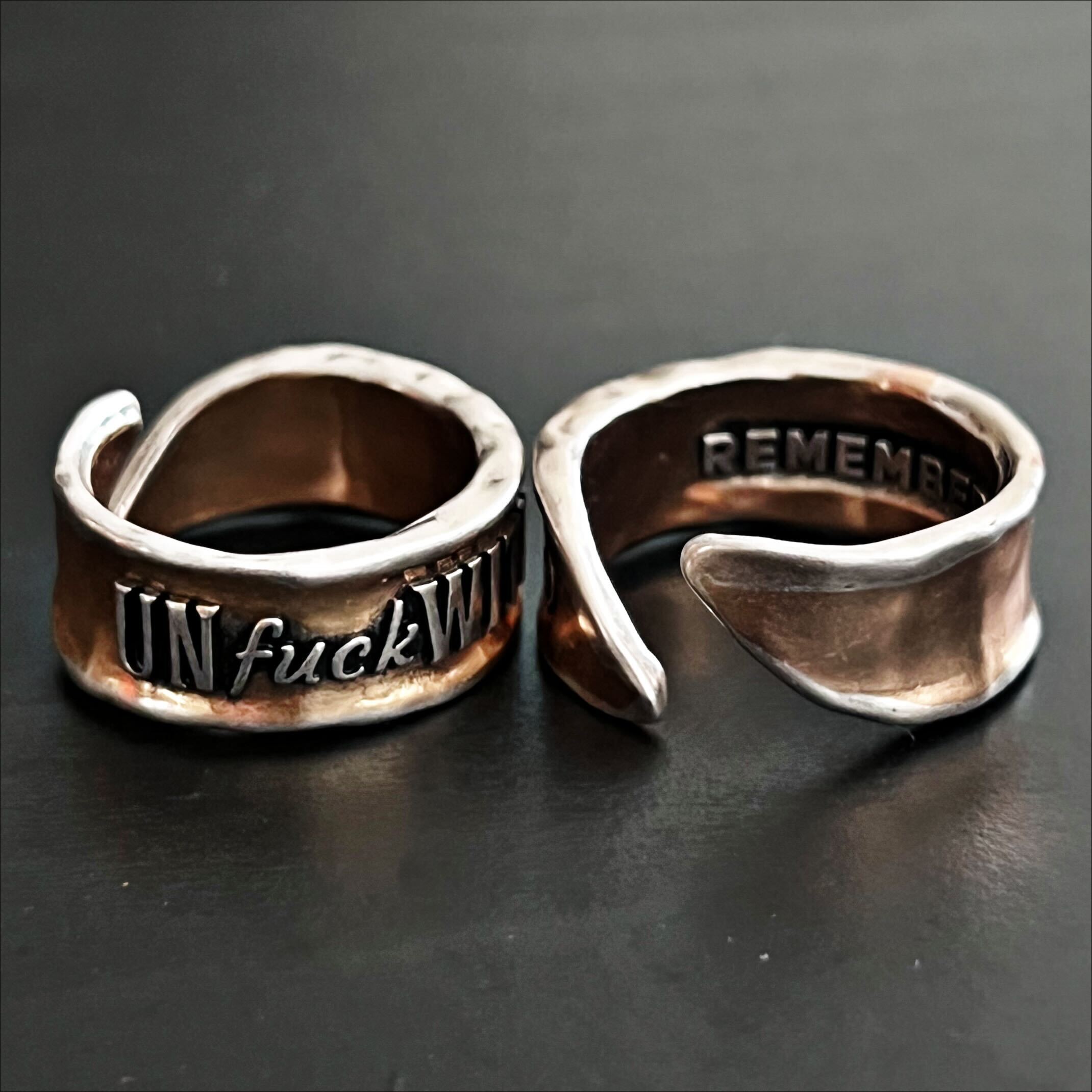 Katia Designs Unf*ckwithable Remember adjustable ring with engraved design, silver-toned metal, and a sleek, modern look.