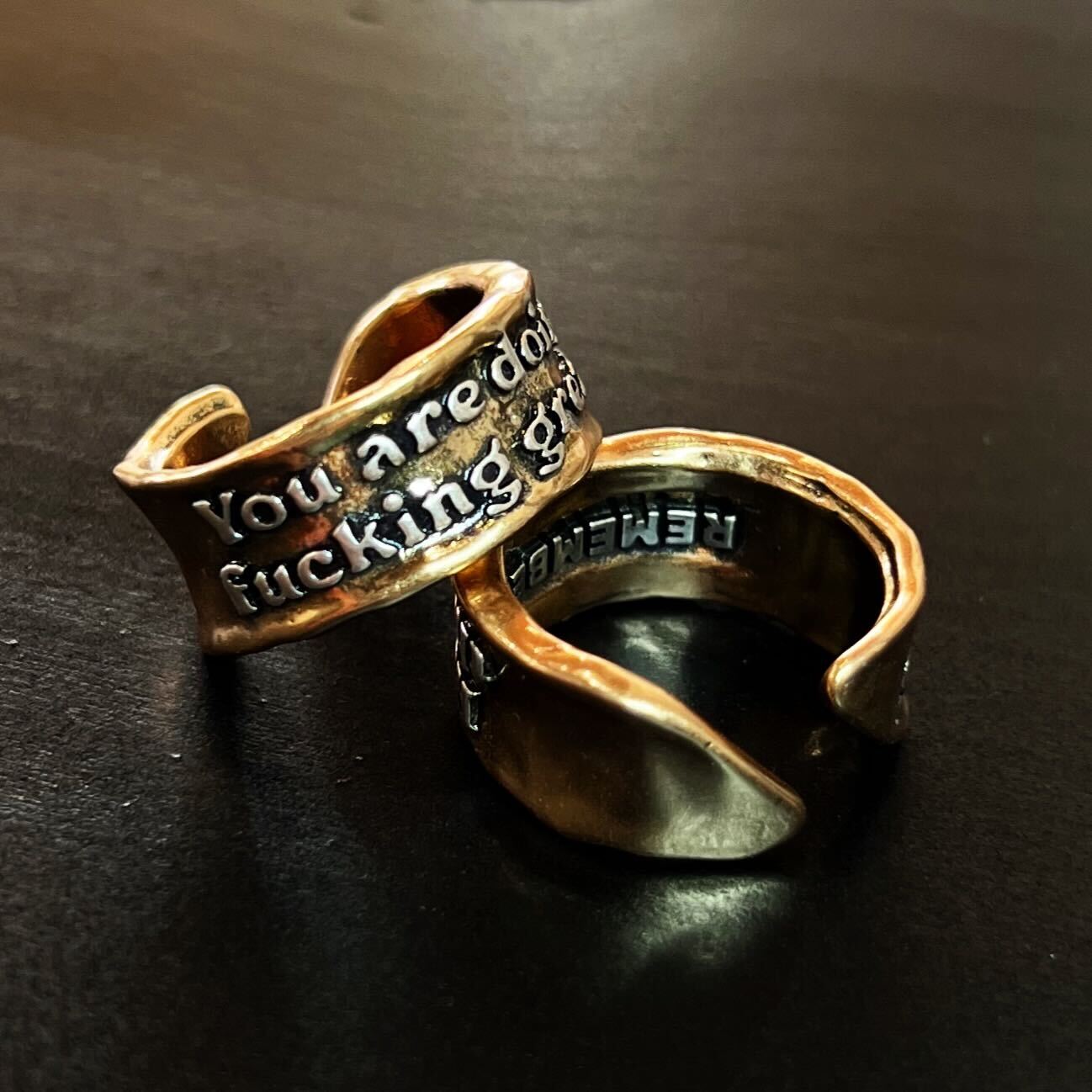 Katia Designs adjustable ring with bold "You Are Doing F*cking Great Remember" inscription, silver-toned metal, stylish accessory.