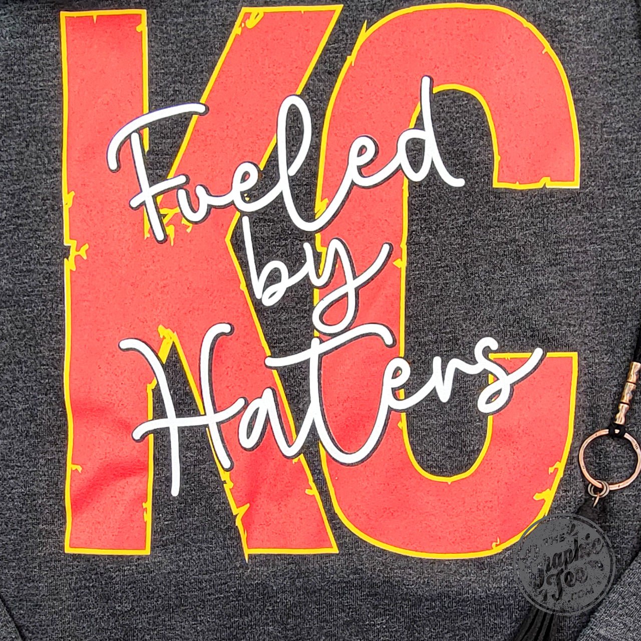 Mineral washed ladies lace-up sweatshirt from KC Fueled By Haters by The Graphic Tee, casual shirt with a relaxed fit.