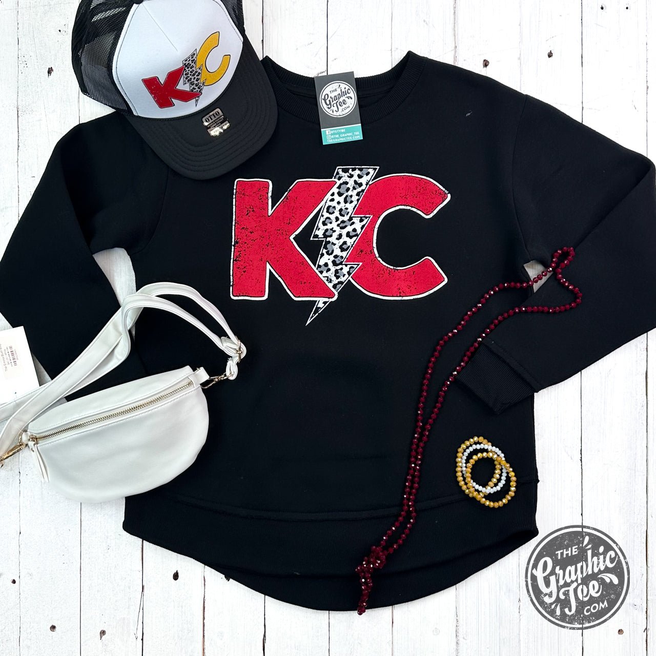 Black women's fleece sweatshirt with lightning bolt graphic and curved hem from The Graphic Tee.