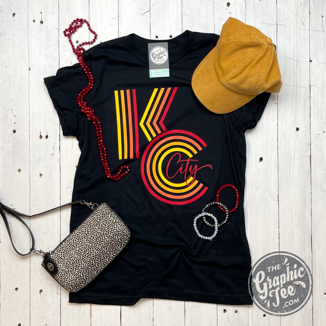 Black KC Ombre Graphic Tee by The Graphic Tee featuring a stylish ombre design on a casual short-sleeve shirt.