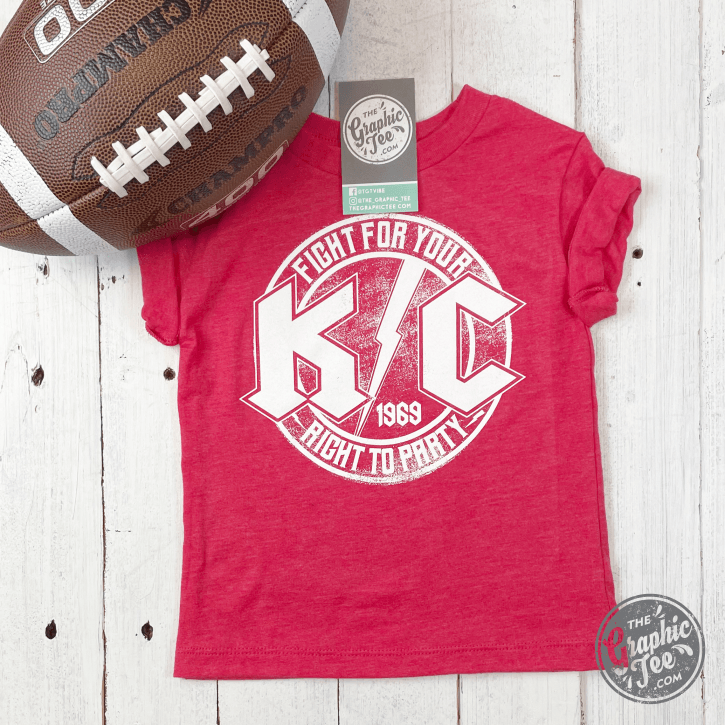 Red youth short sleeve graphic tee from The Graphic Tee featuring KC Rock design, ideal for casual wear and everyday style.