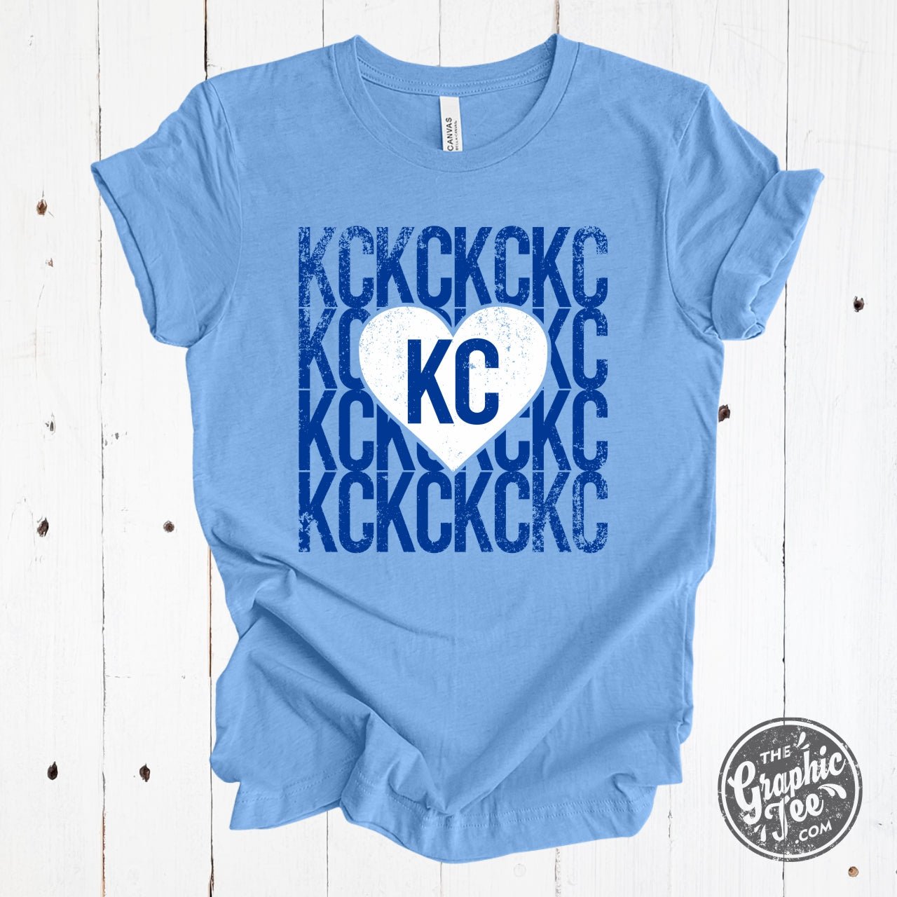 The Graphic Tee Heart Heather Carolina Blue SS Graphic Tee showing a stylish heart graphic on the front.