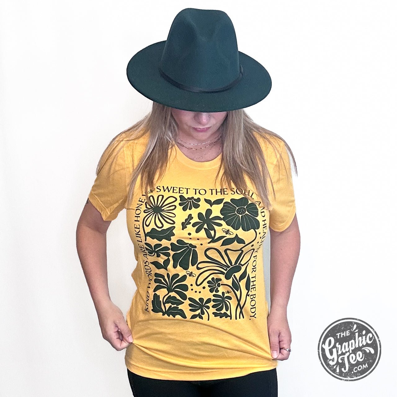 Heather golden yellow short sleeve graphic tee from The Graphic Tee with the "Kind Words" design on the front.