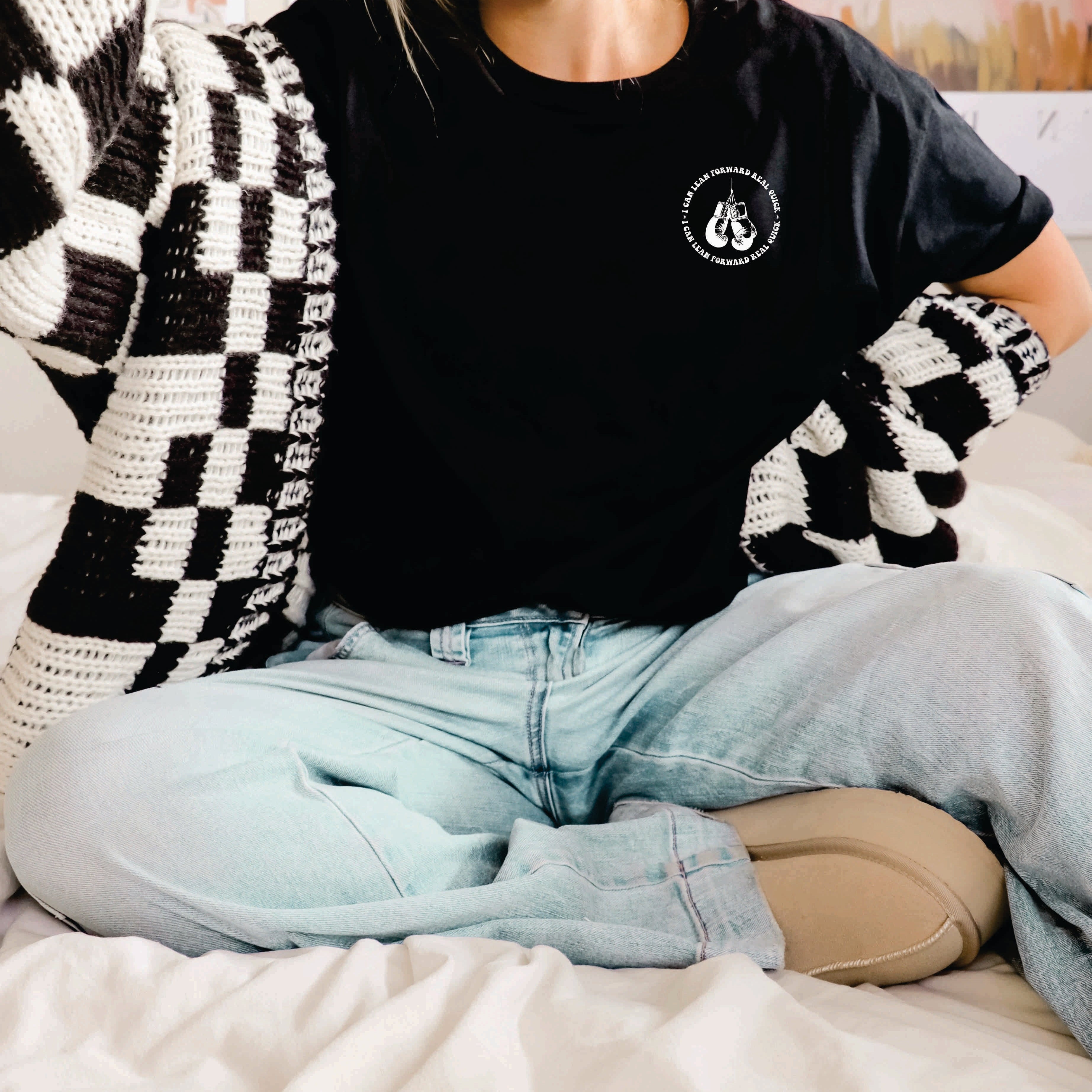 Black graphic t-shirt from Shop Karma Tees featuring the phrase "I Might Be Laid Back" in bold lettering.