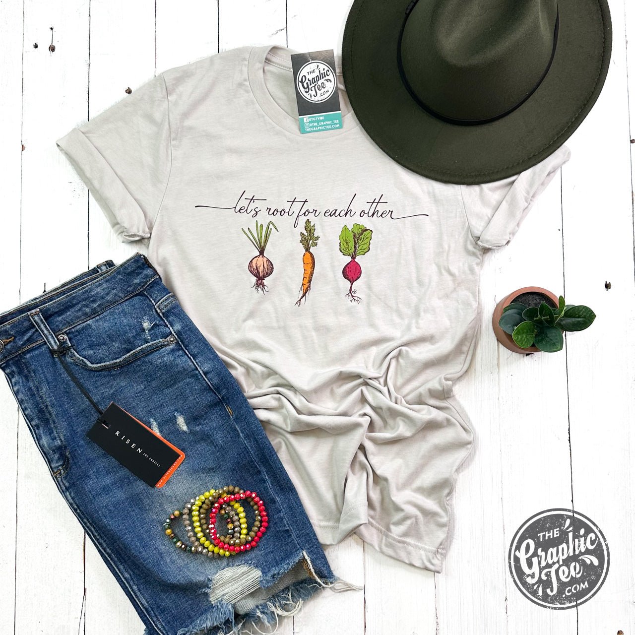 The Graphic Tee's Let's Root For Each Other short sleeve graphic tee featuring positive message and casual fit.