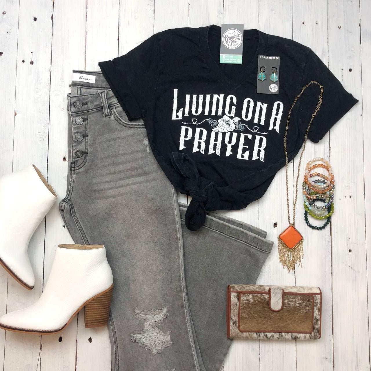 Living On A Prayer V-neck graphic T-shirt by The Graphic Tee, featuring band-inspired design on soft cotton fabric.