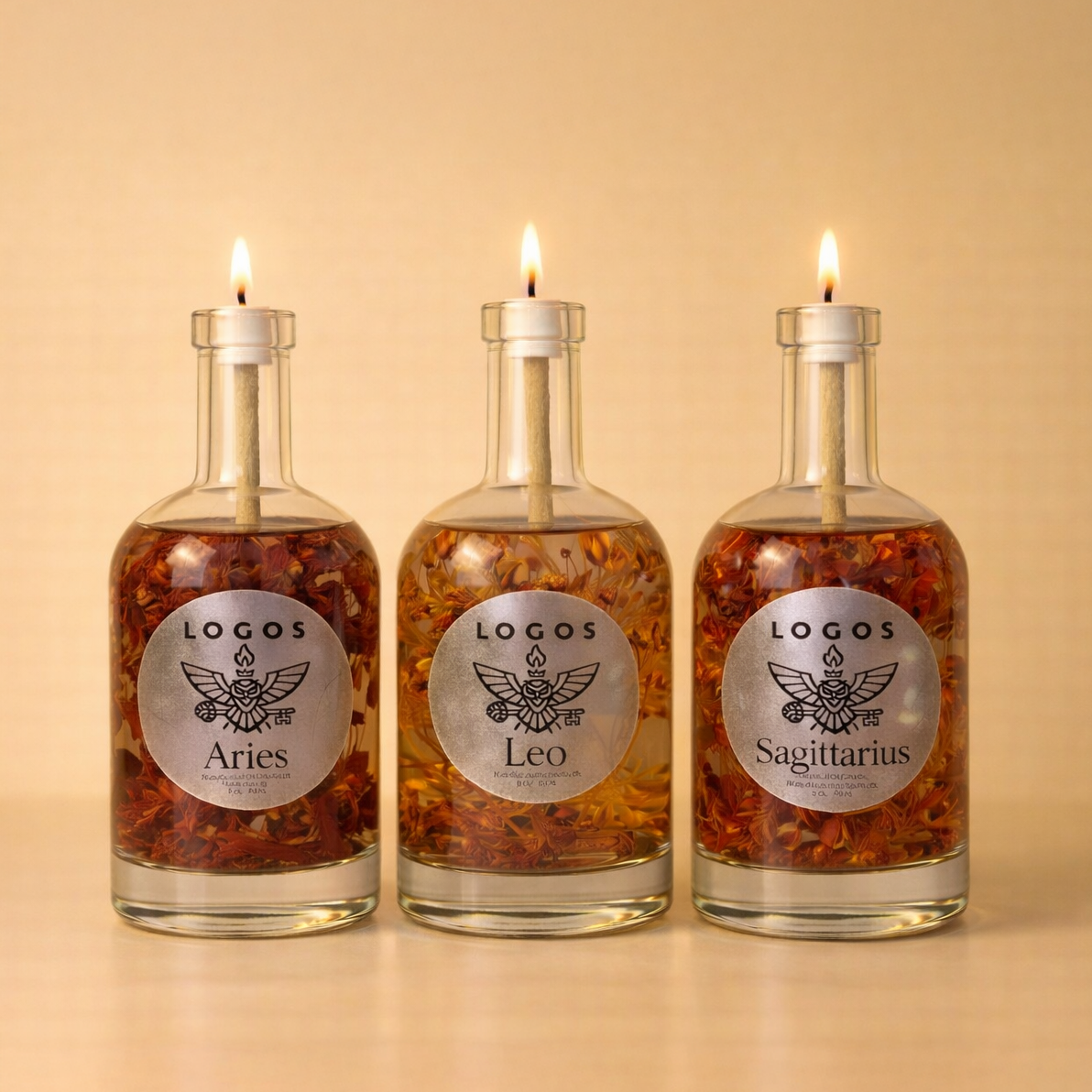 Logos Candles Fire Trio set featuring three elemental fire-themed candles in decorative containers.