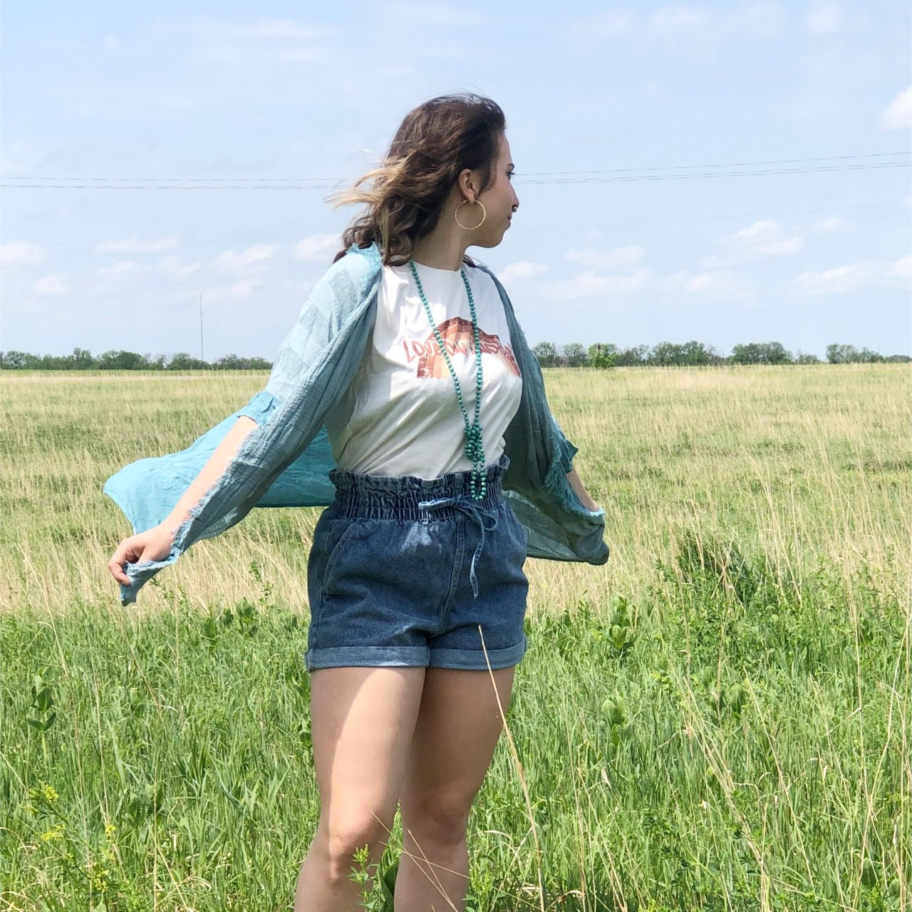 Vintage Love One Another SS Graphic Tee by The Graphic Tee, featuring a colorful printed design on a casual cotton T-shirt.