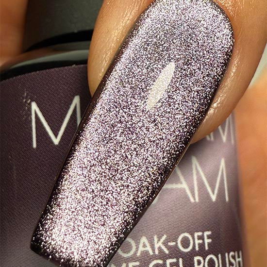 Dark purple velvet nail polish from Madam Glam's Haunted Velvet collection, showcased in a sleek bottle with a glossy finish.