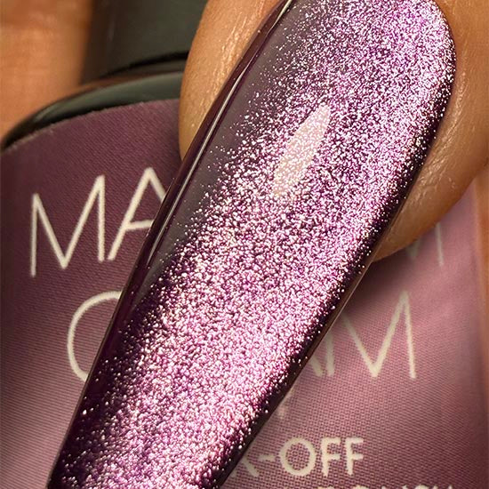 Madam Glam Hocus Plum nail polish bottle with purple-colored polish and sleek packaging, close-up shot.