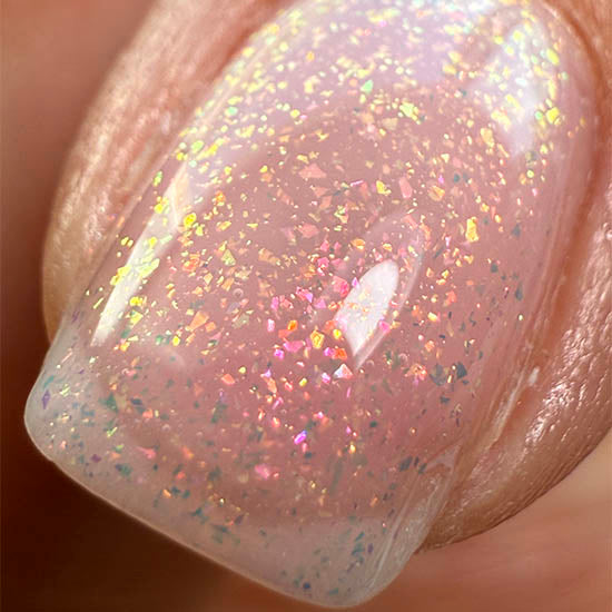 Pink Mermaid nail polish by Madam Glam featuring a shimmering pink mermaid-inspired color in a sleek bottle.